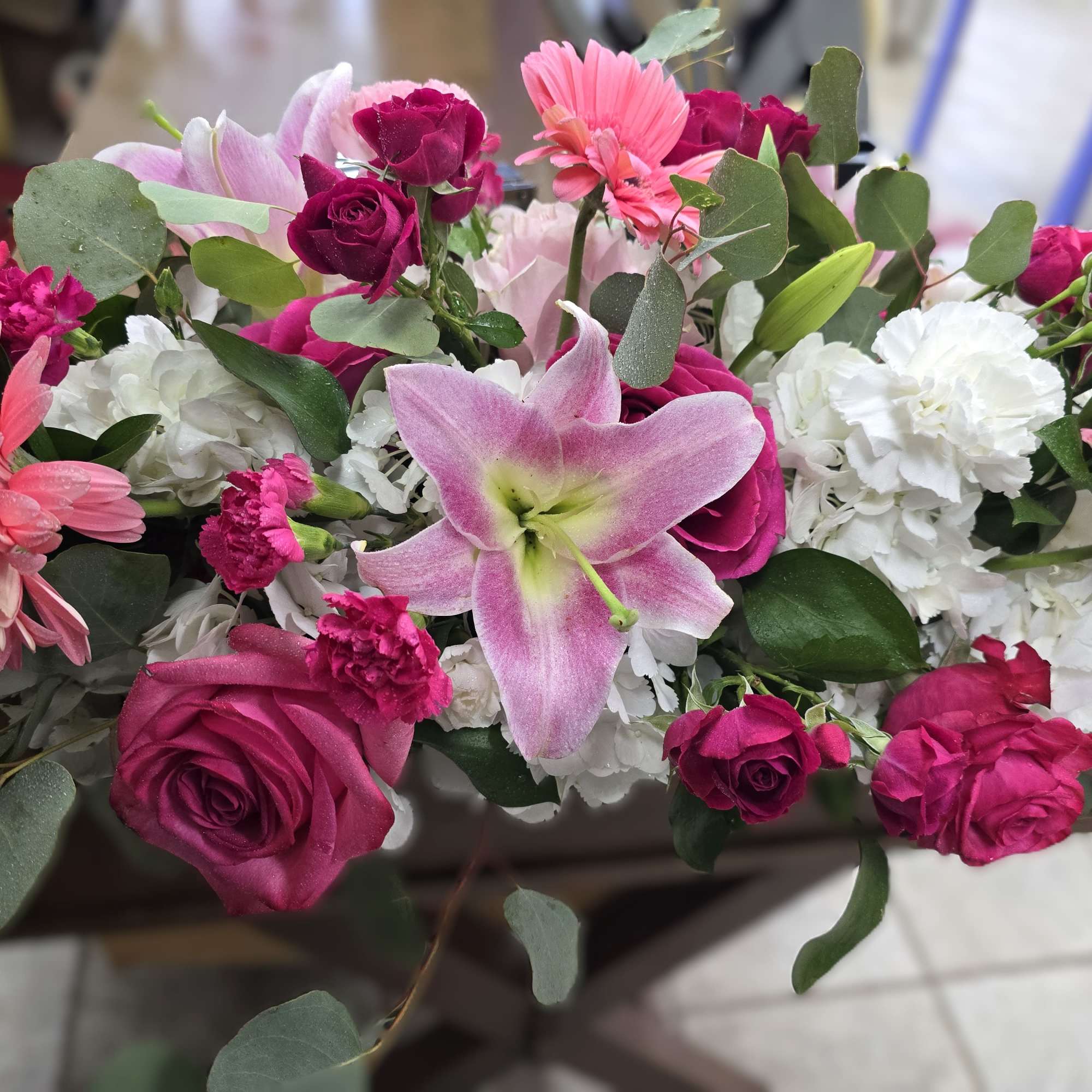 Mixed bouquet with pink lilies, roses, gerbera daisies, and white carnations