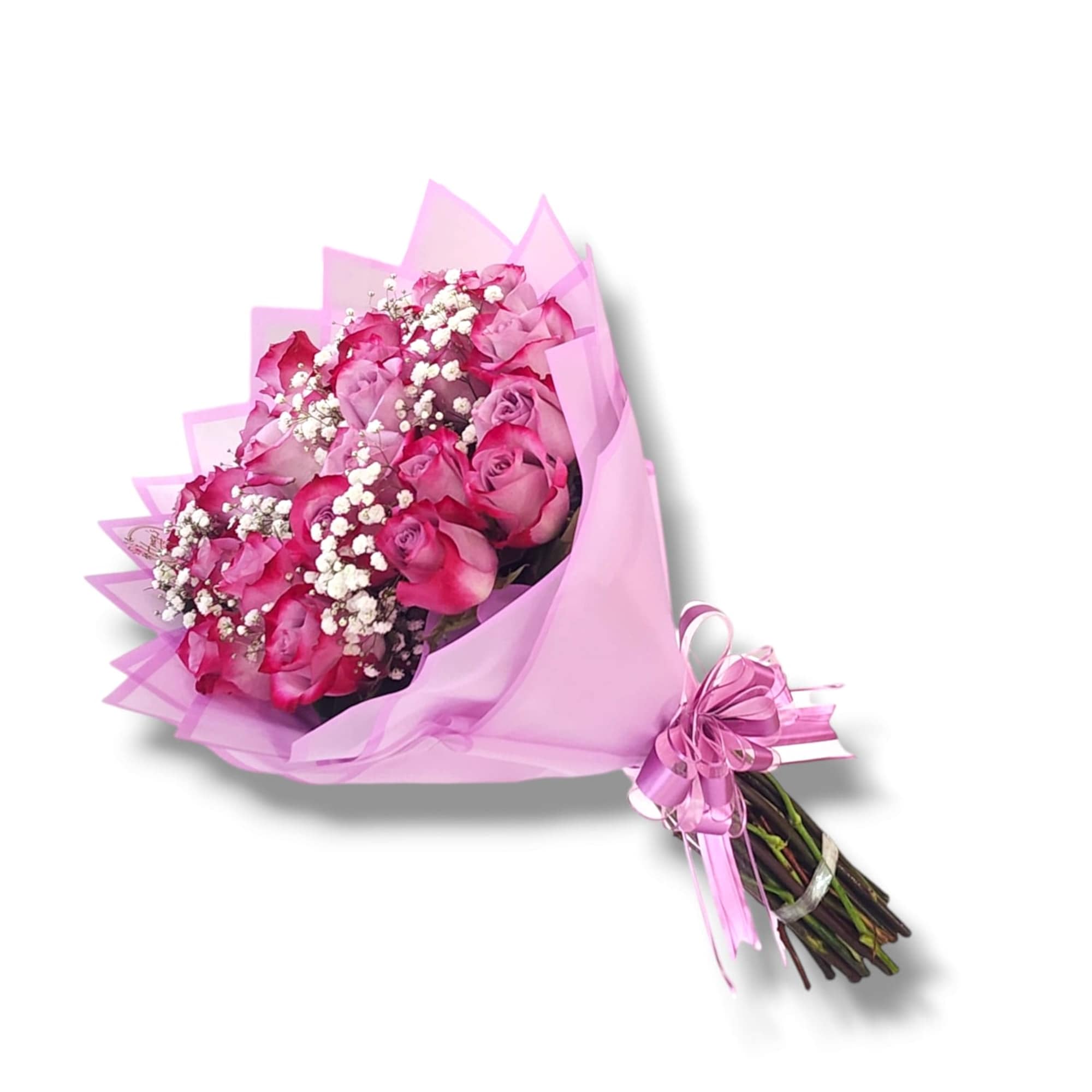 Hand-tied bouquet of pink roses and white filler flowers wrapped in pink paper.