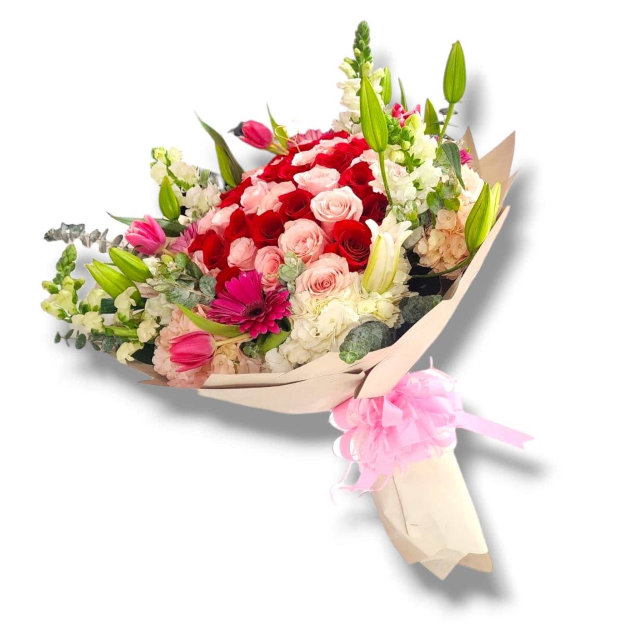 Bouquet of red and pink roses with lilies and white flowers in paper wrap