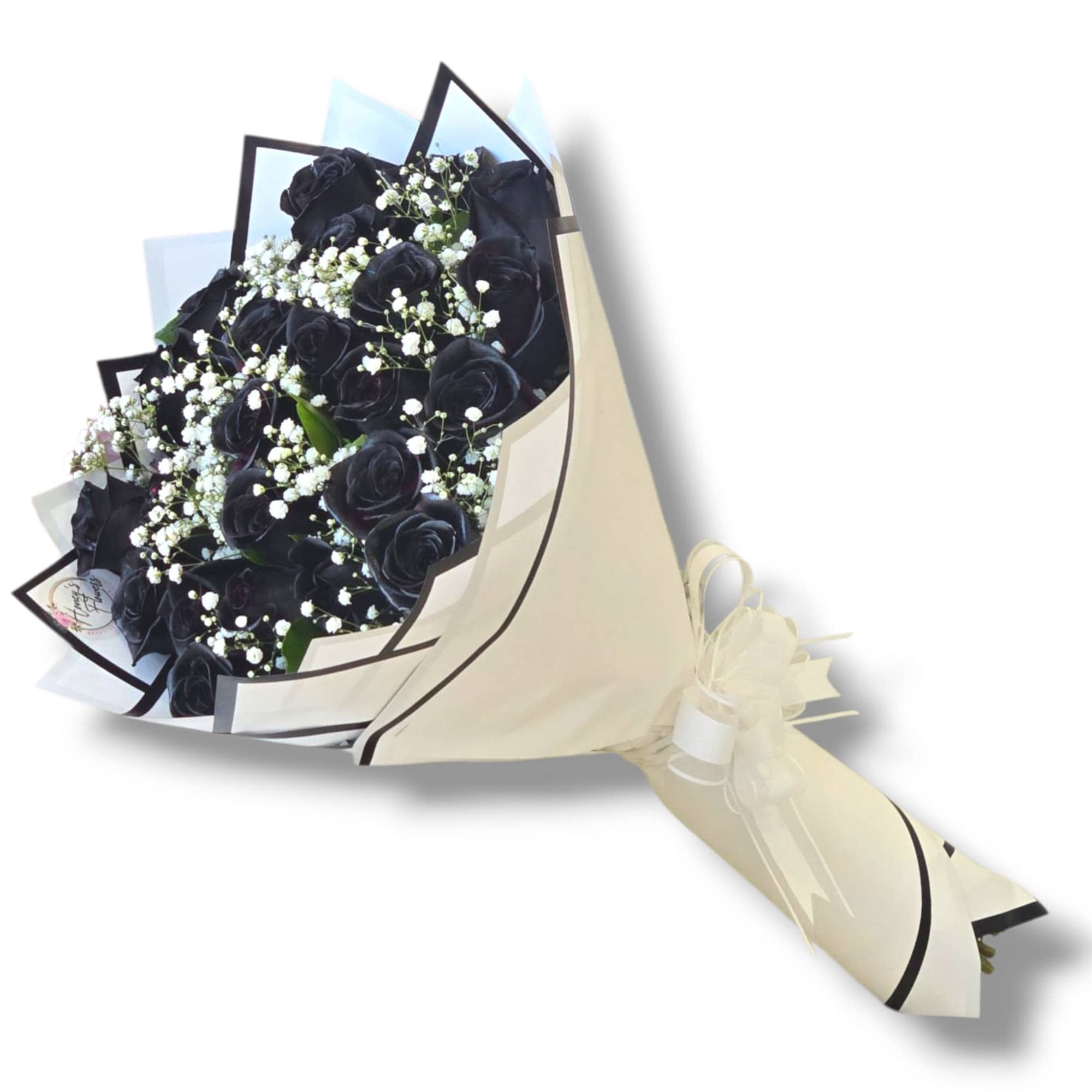Bouquet of black roses with small white filler flowers wrapped in cream paper with a white bow