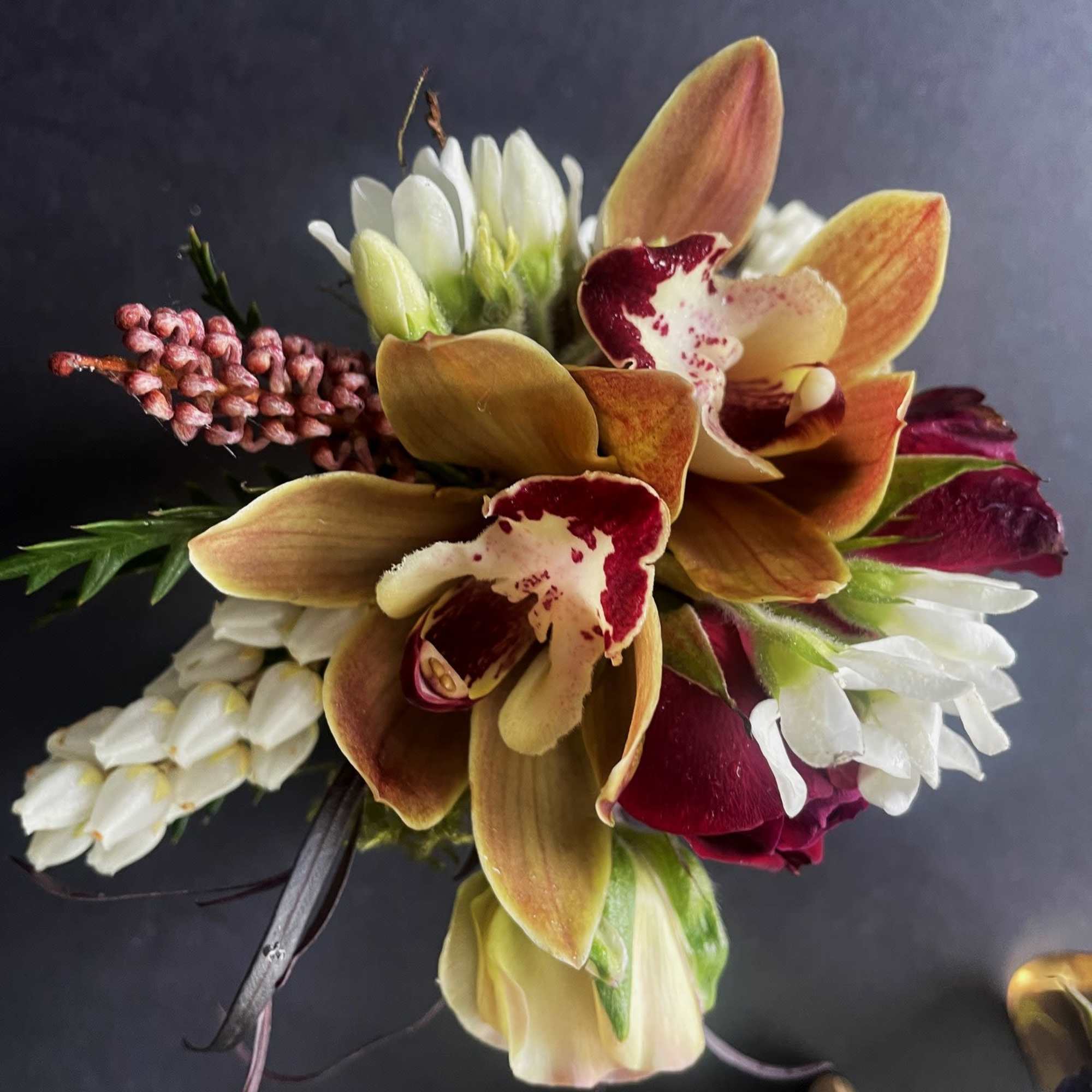 Corsages are a timeless symbol of tradition and elegance, serving as a, photo 2 of 2