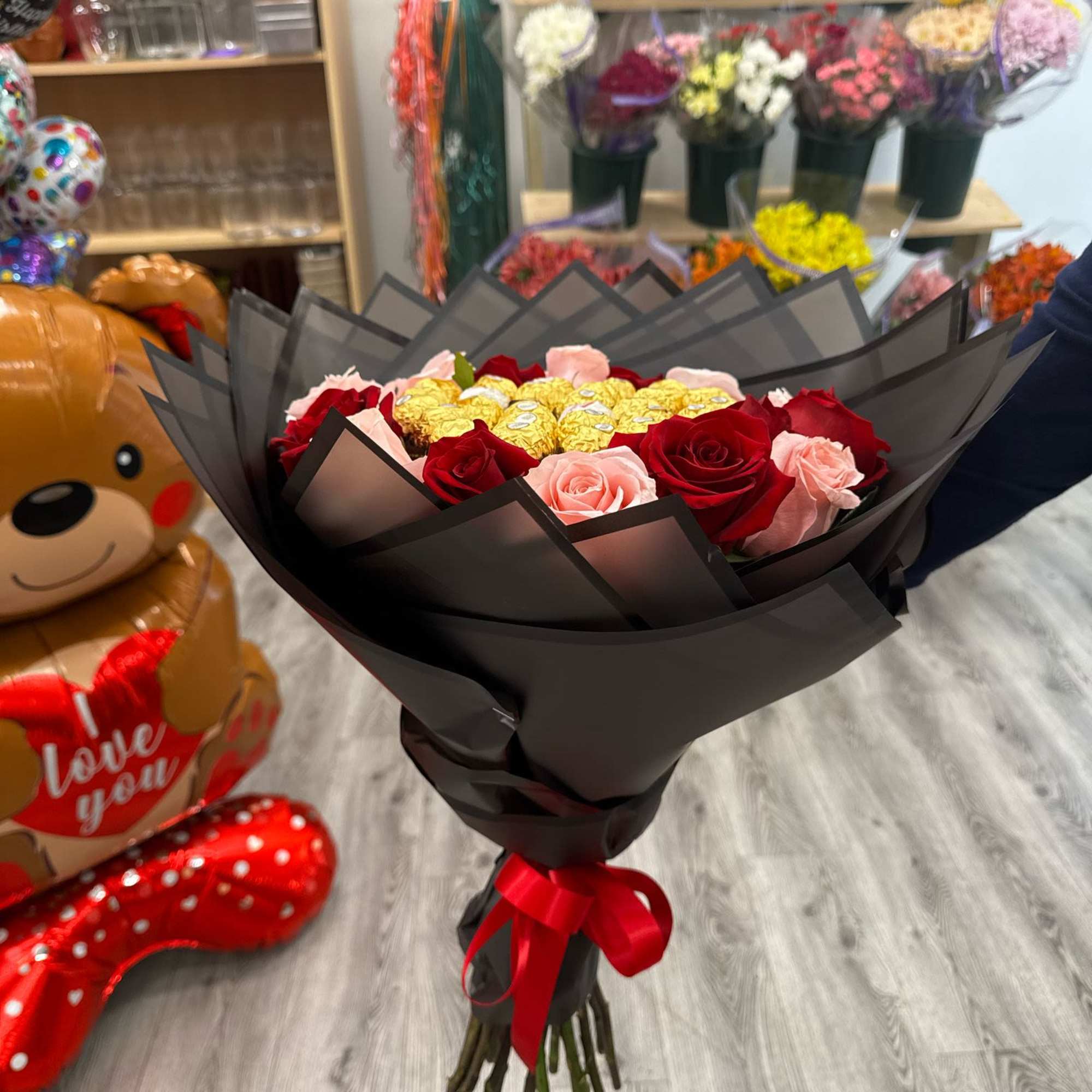 Bouquet with Ferreros chocolates and mix roses , wrapped in floral paper, photo 2 of 2