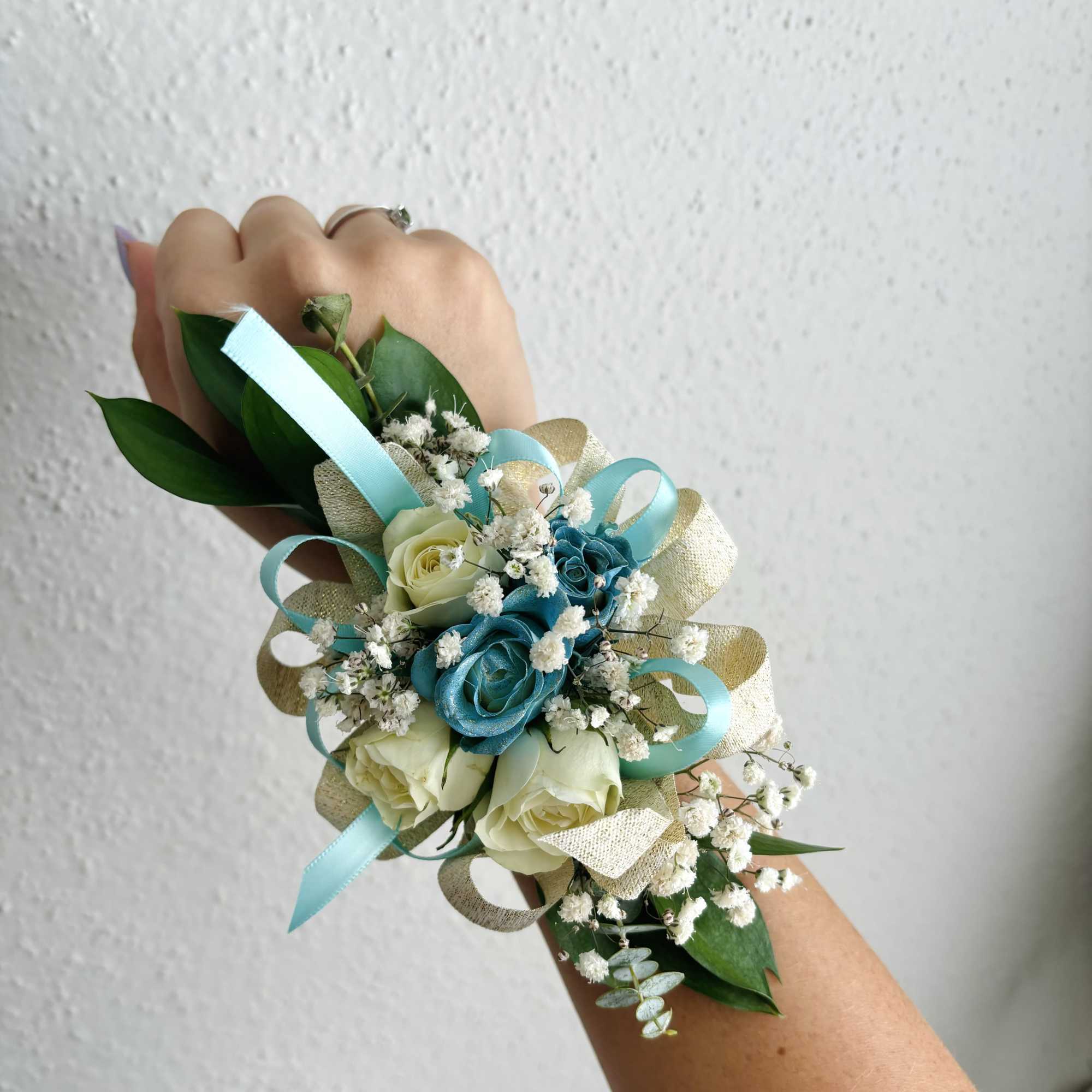 Small wrist corsage with blue and white roses and ribbon, photo 7 of 9
