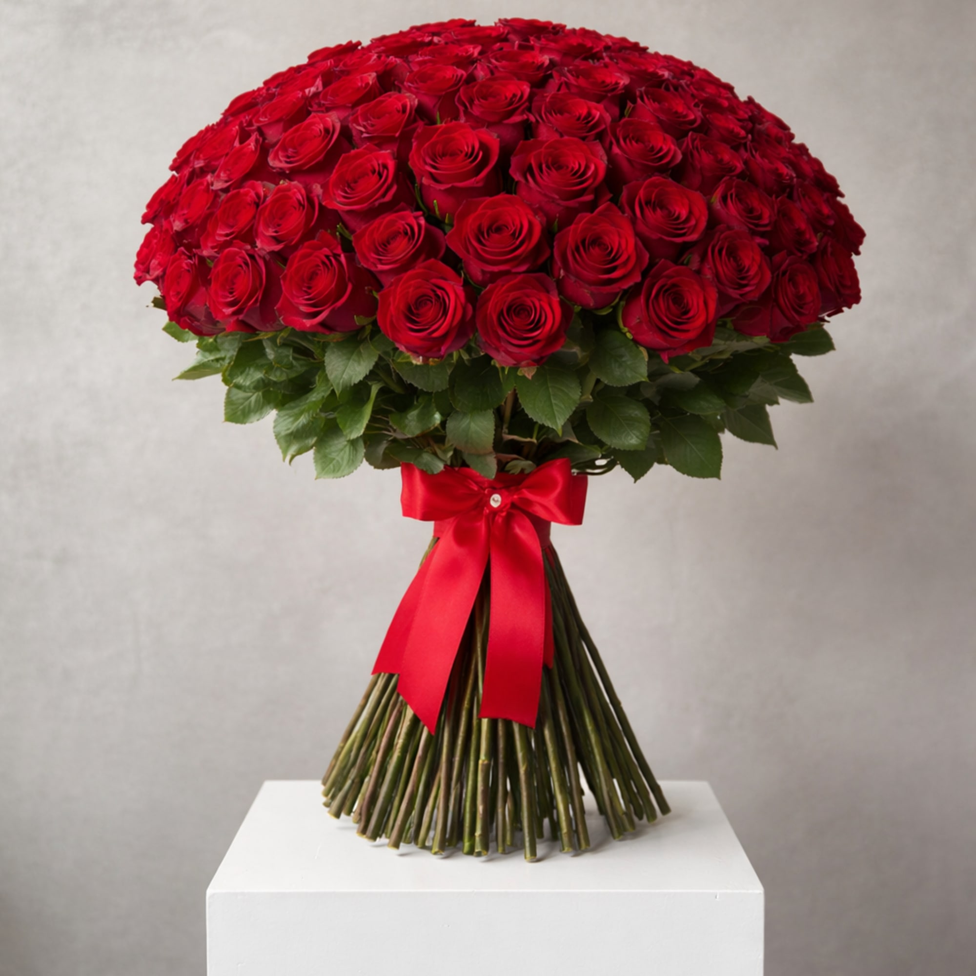 Large bouquet of red roses tied with a red ribbon