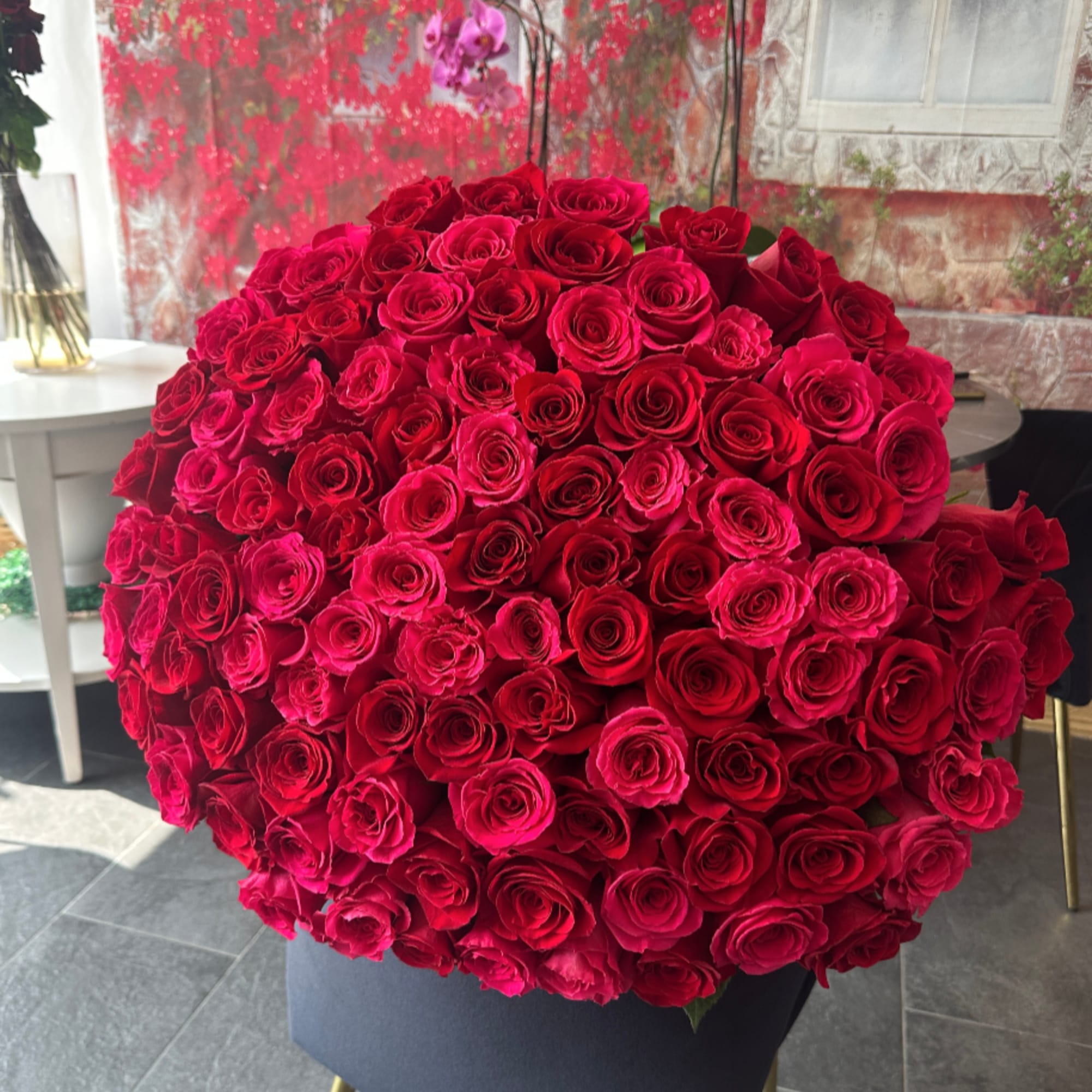 Large bouquet of red roses in a dark wrap