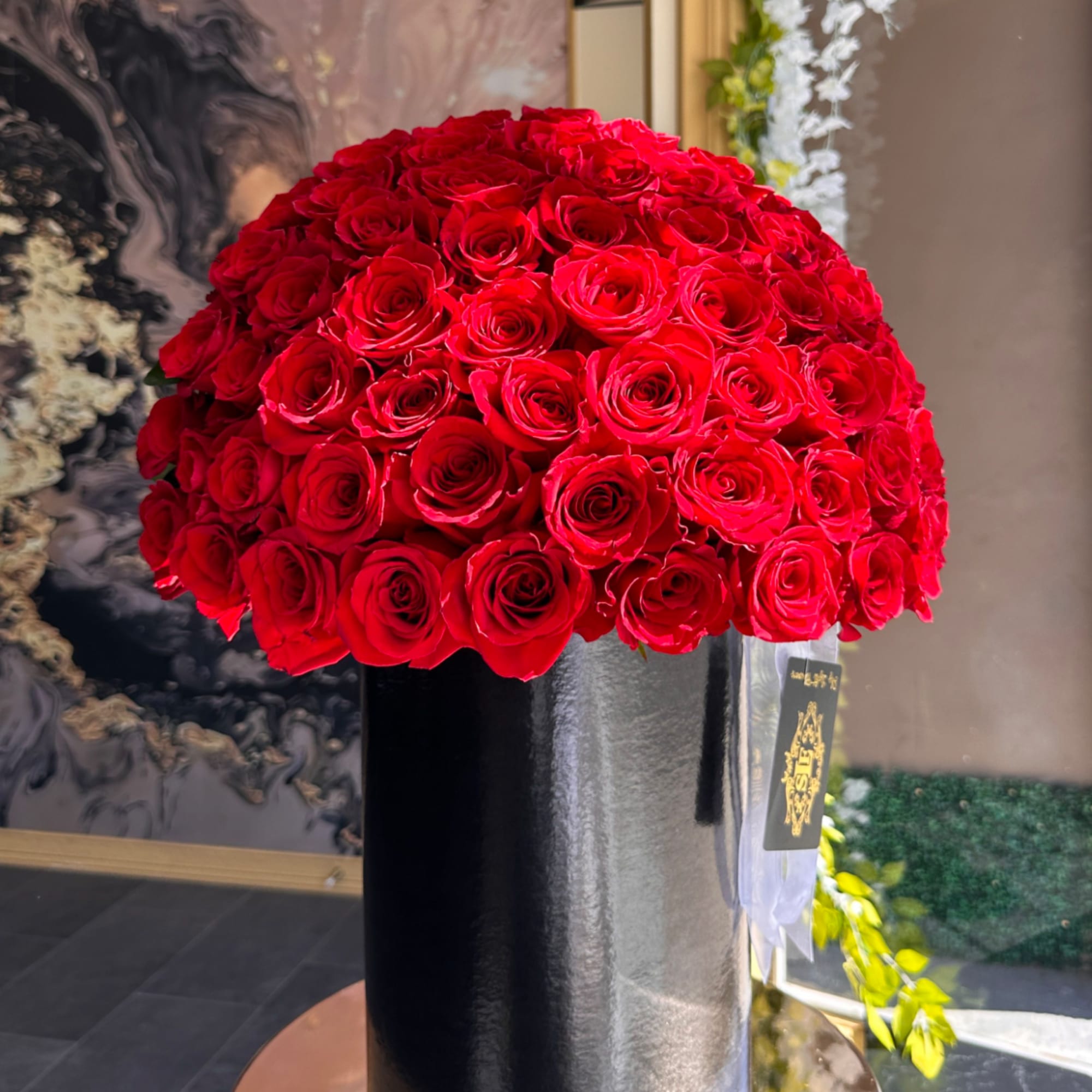 Brighten any space with our Elegant Flower Box Arrangement! Bursting with vibrant