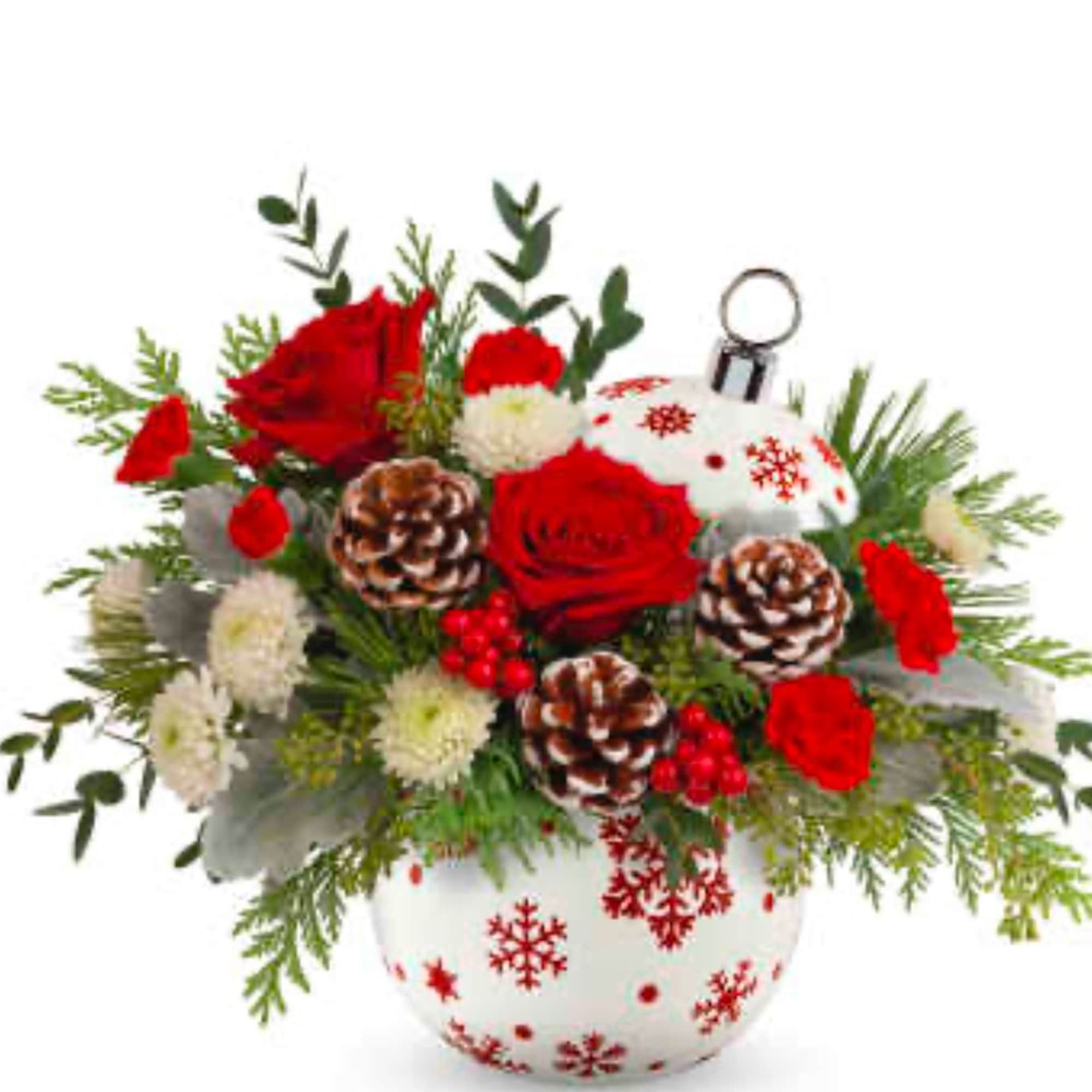Red roses and white blooms in a snowflake vase with pinecones