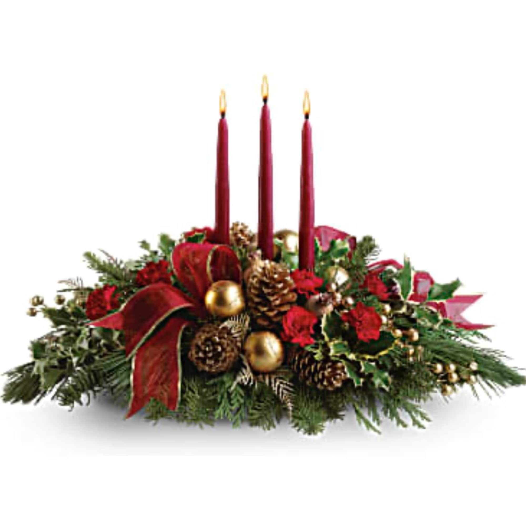 Holiday centerpiece with three red candles, pinecones, and red flowers
