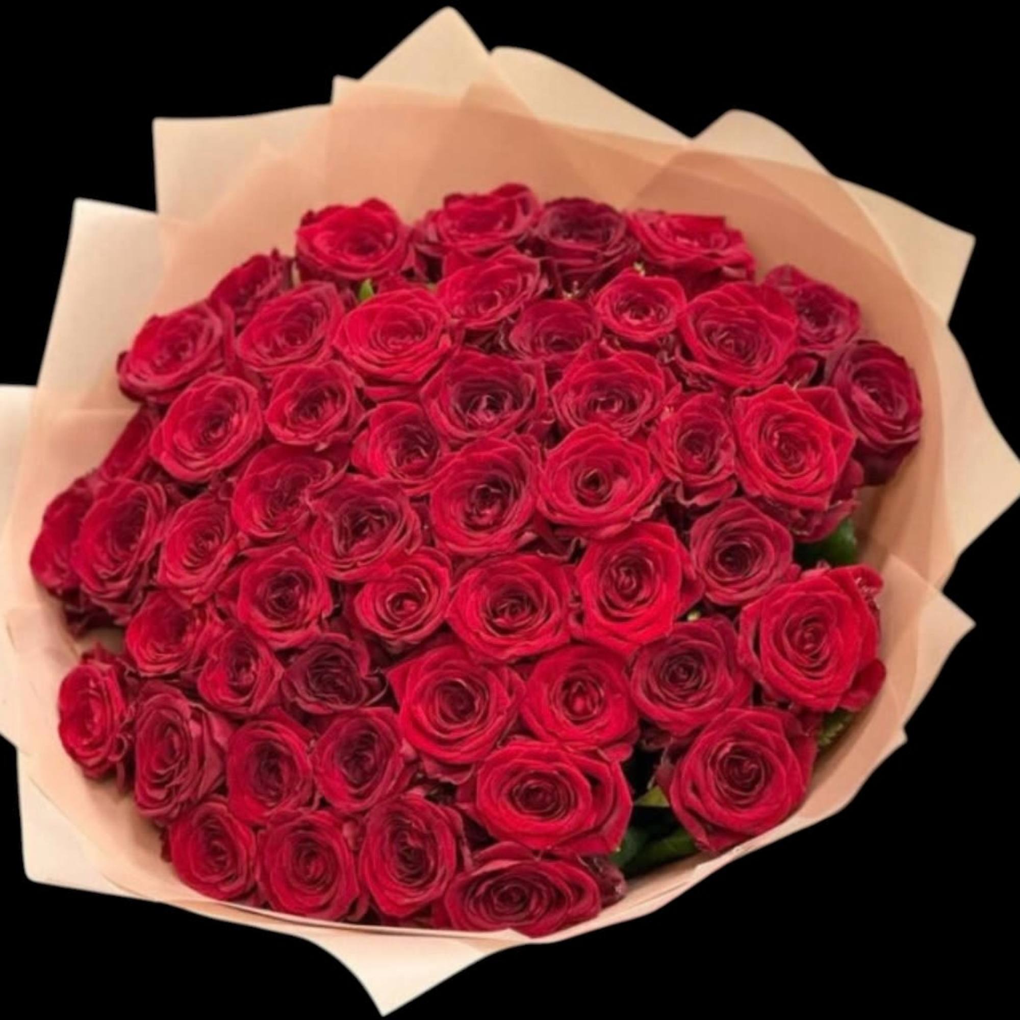Bouquet of red roses wrapped in pale paper