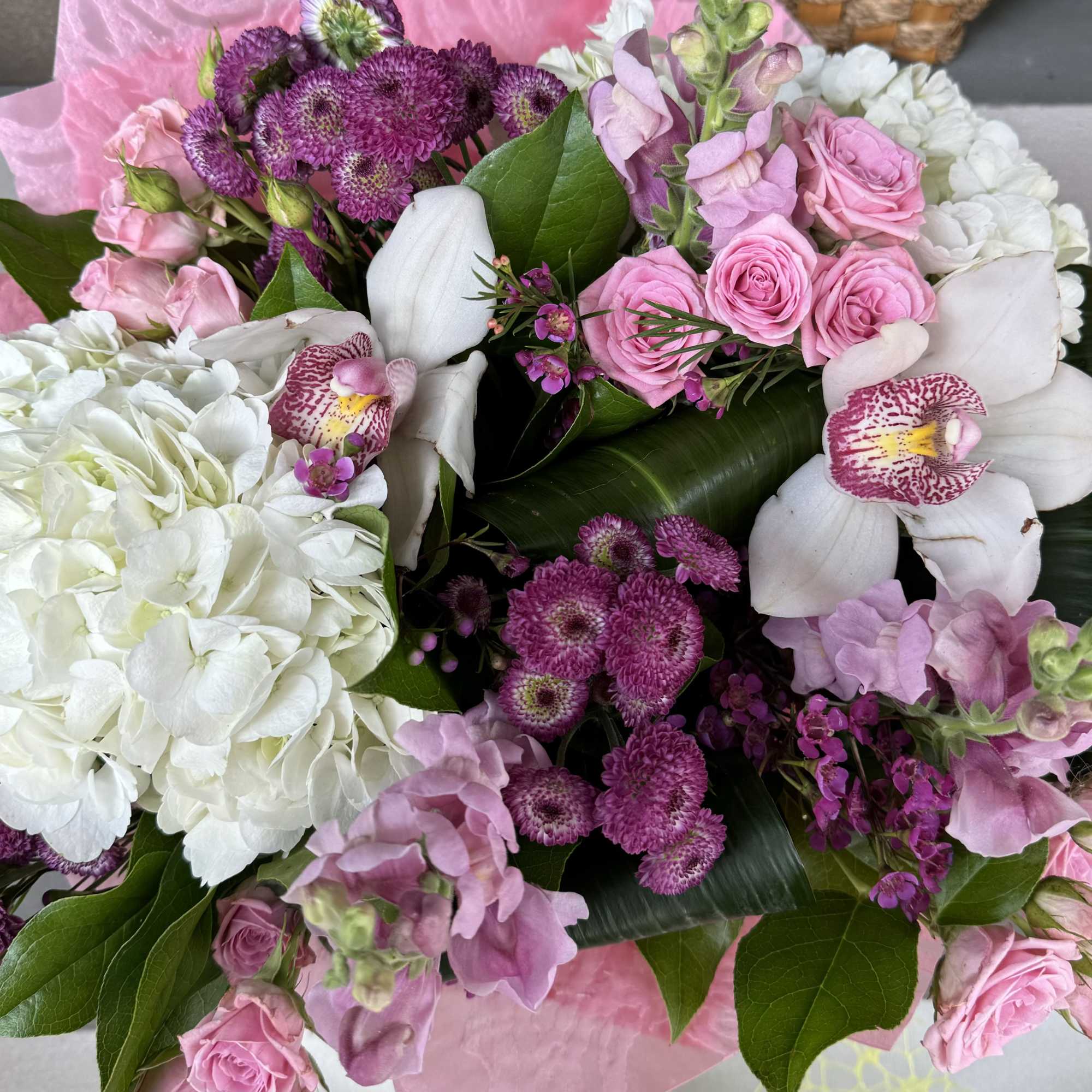 Bouquet of pink and white flowers with orchids and hydrangeas