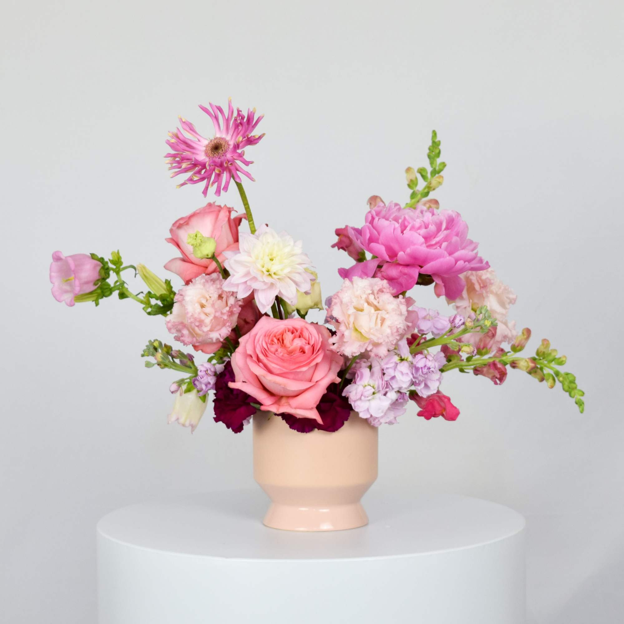 Pink and white mixed bouquet in a blush vase