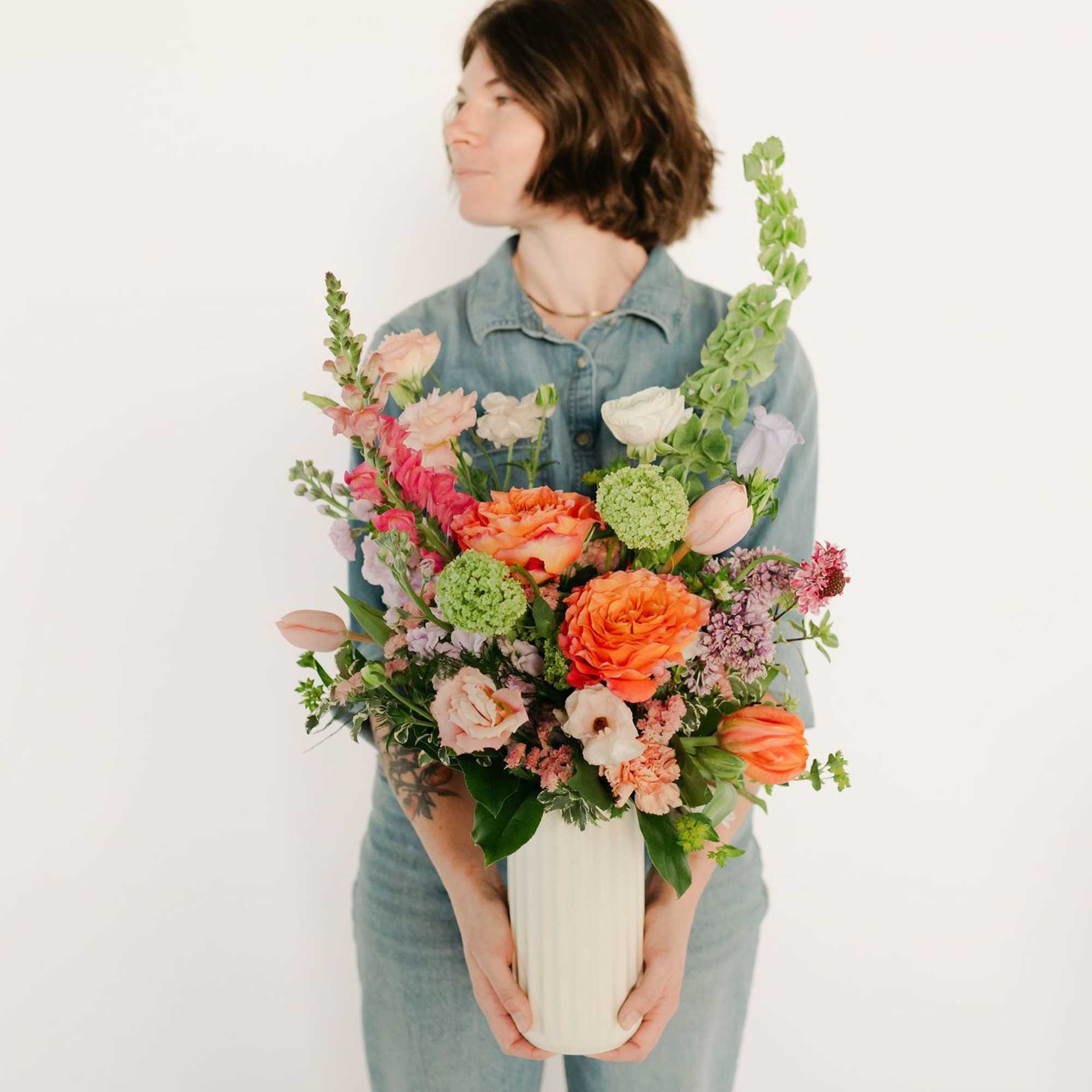 A lush blend of peaches, blush pinks, soft lavenders, and fresh greens, photo 3 of 4