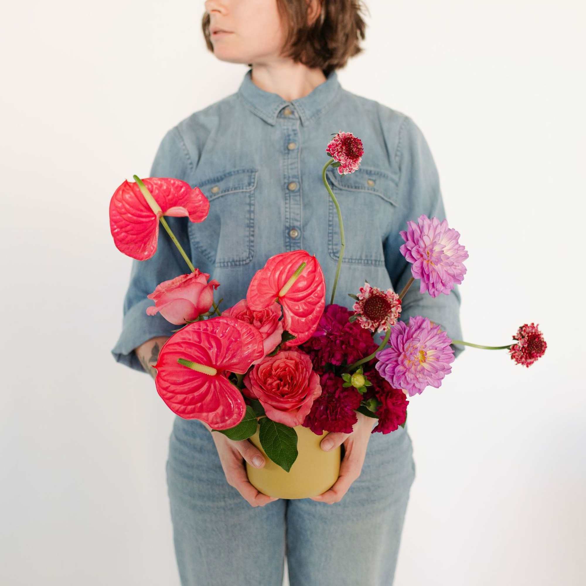 A whimsical, modern, sculptural design featuring bright, tropical anthuriums, premium textured dahlias, photo 2 of 2