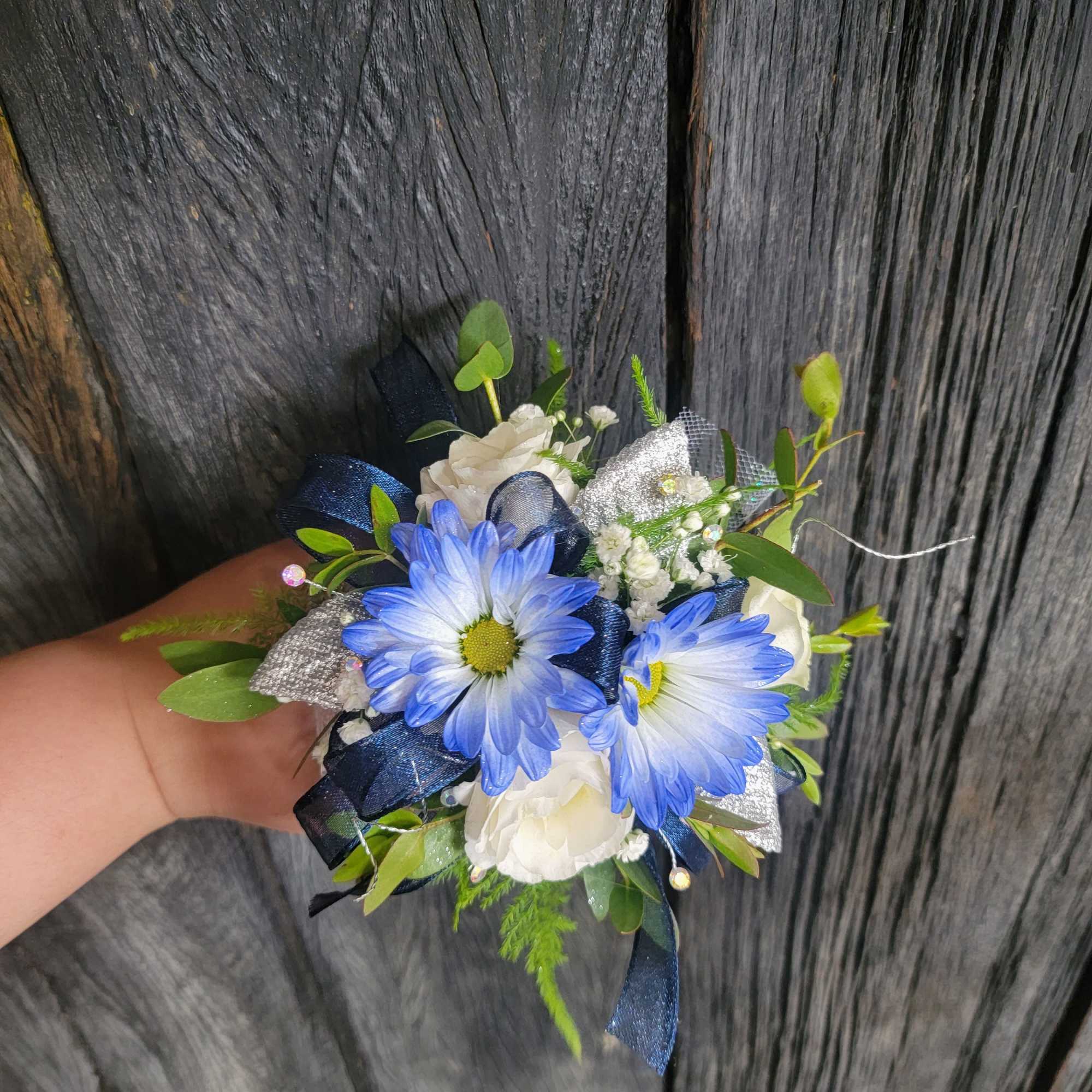 A beautiful corsage with blue tones made with your choice of flowers., photo 3 of 4