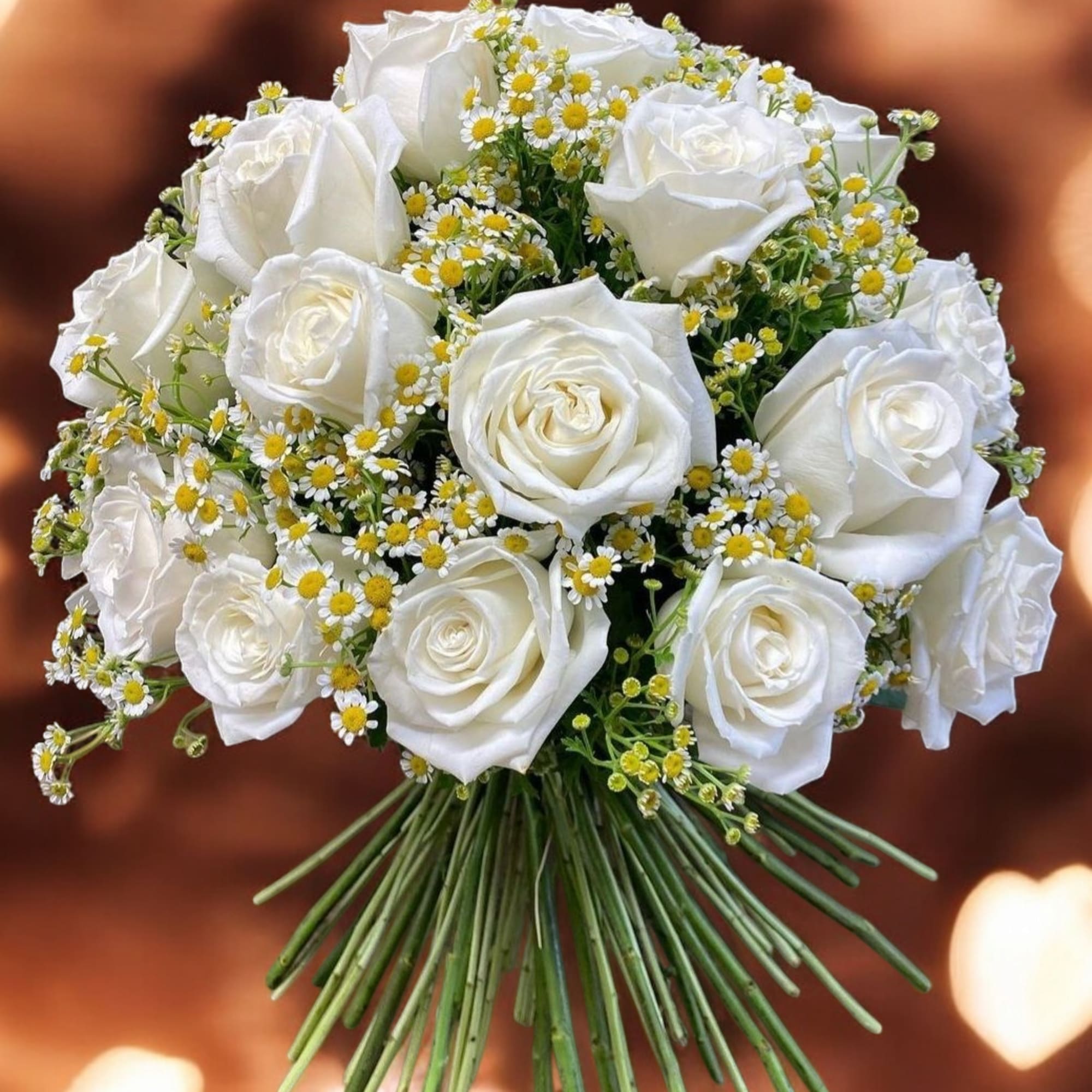 Bouquet of white roses and small yellow-white daisies