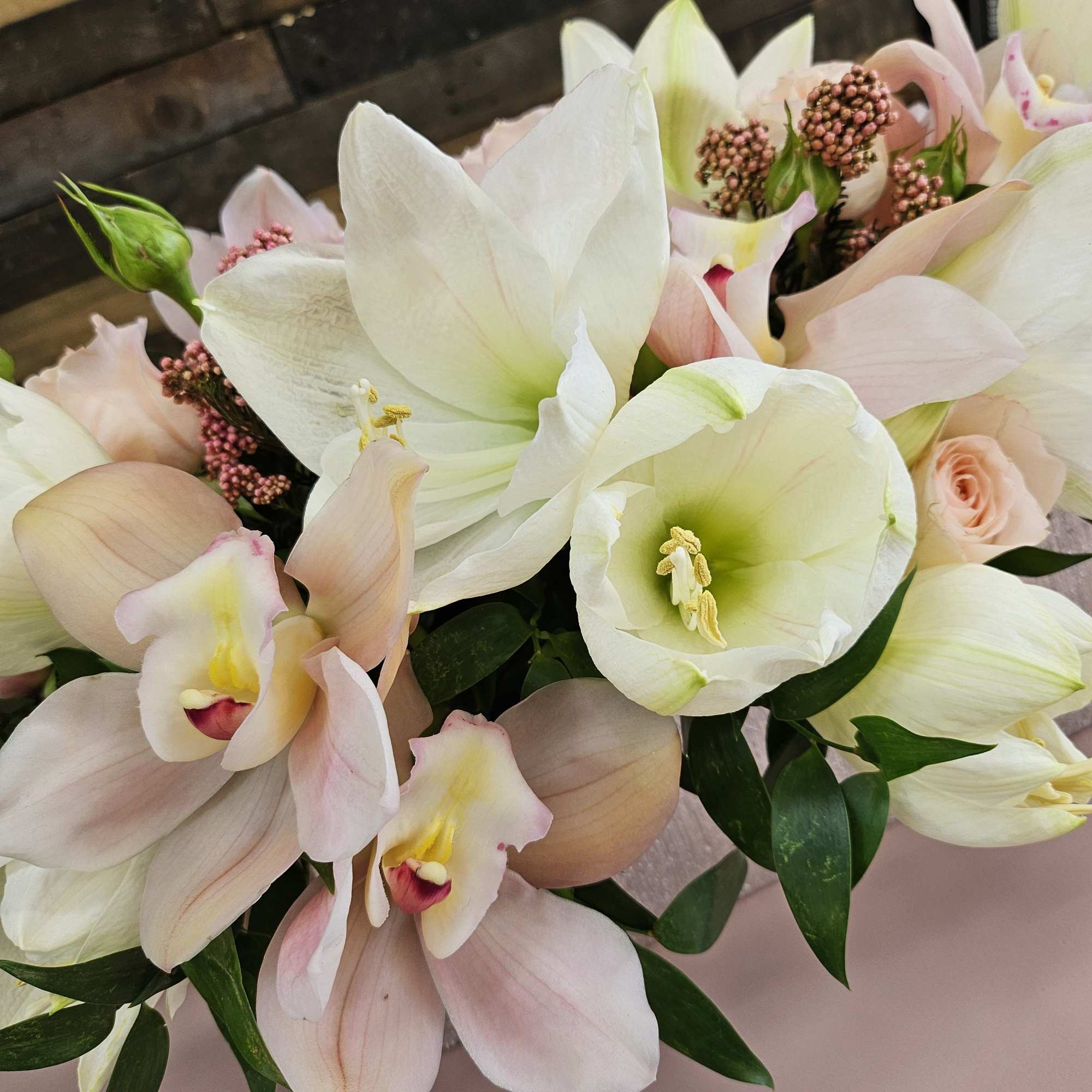 Bouquet of white and blush orchids with pale pink calla lilies