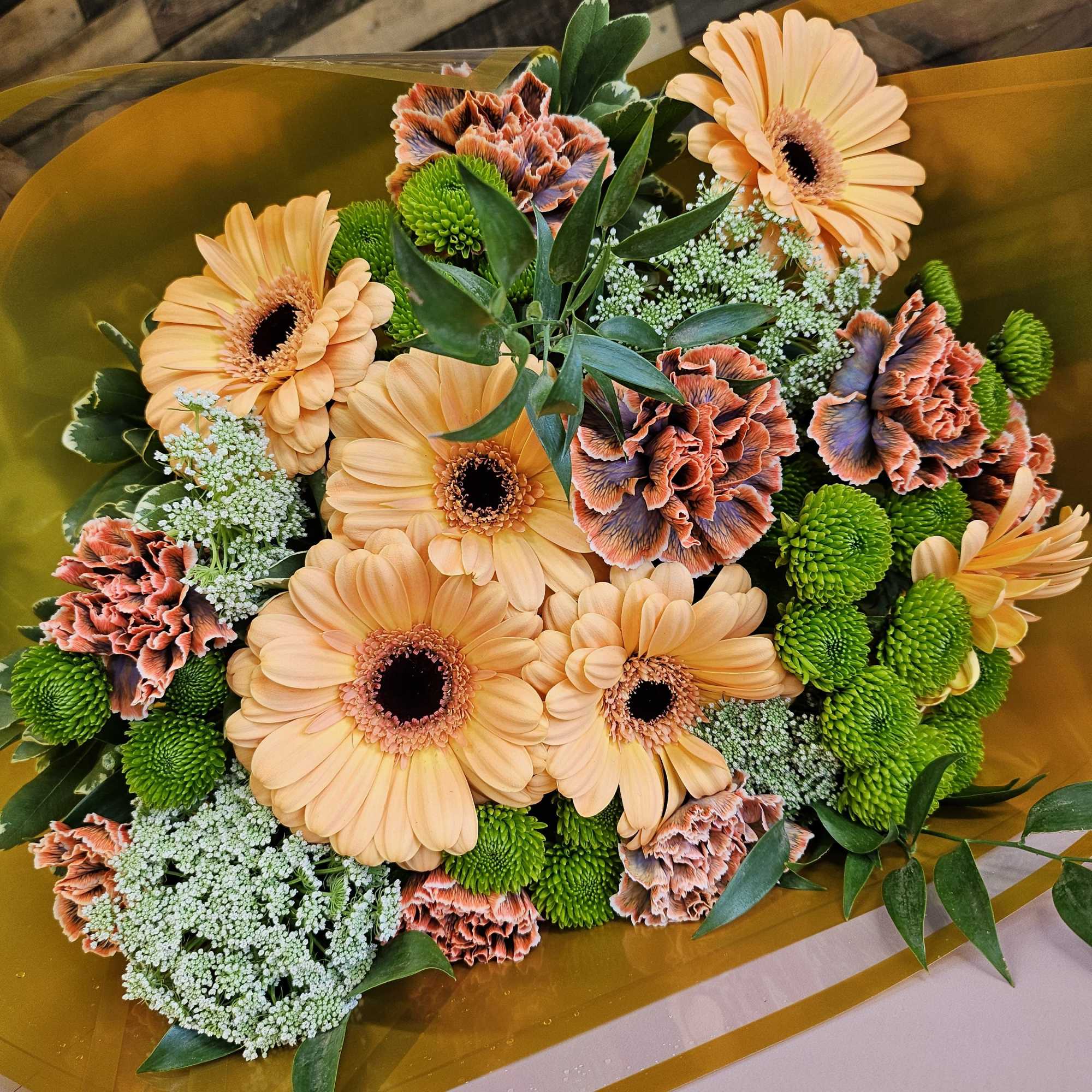 Bouquet of peach gerbera daisies and green chrysanthemums with carnations