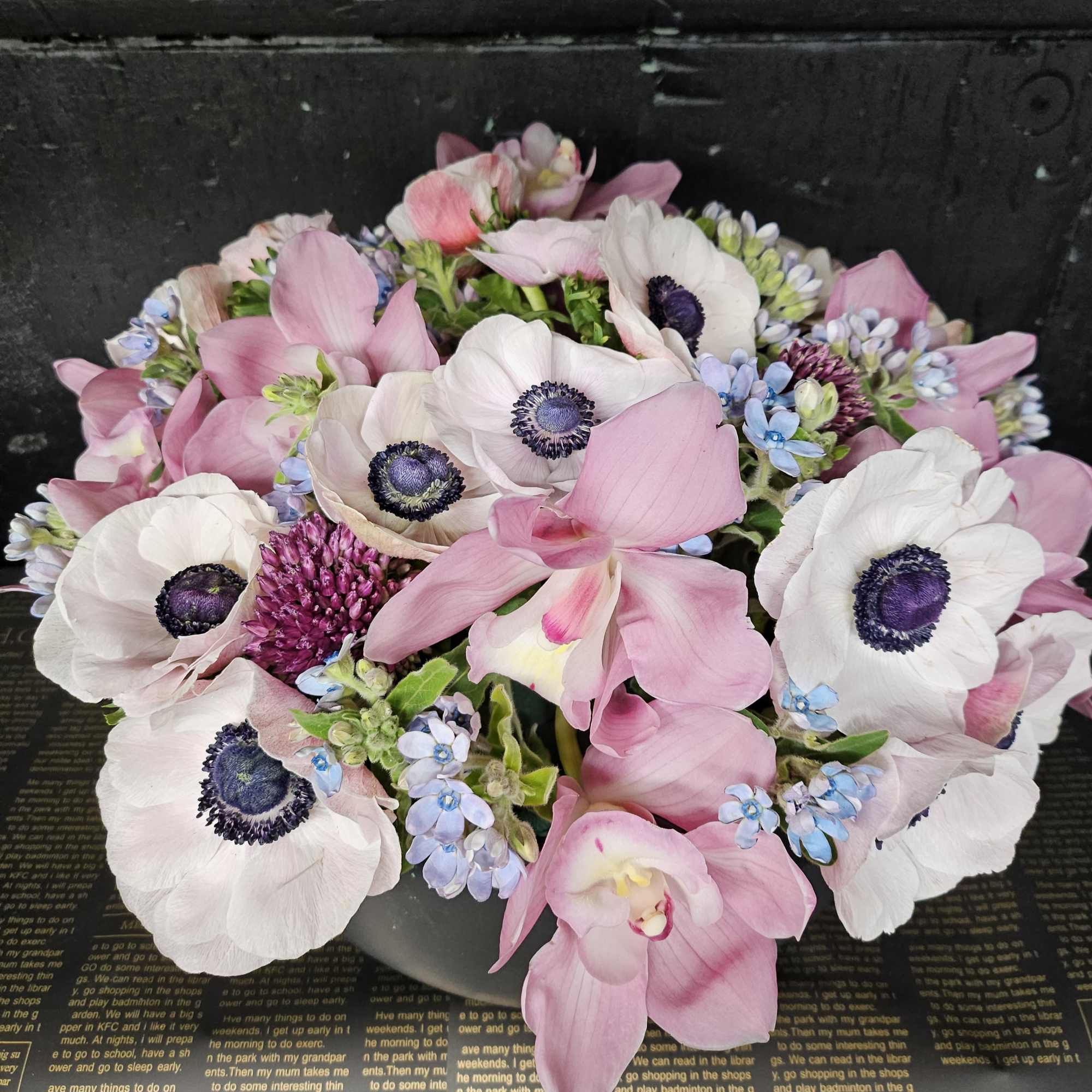 Pink and white anemones arranged in a low bouquet