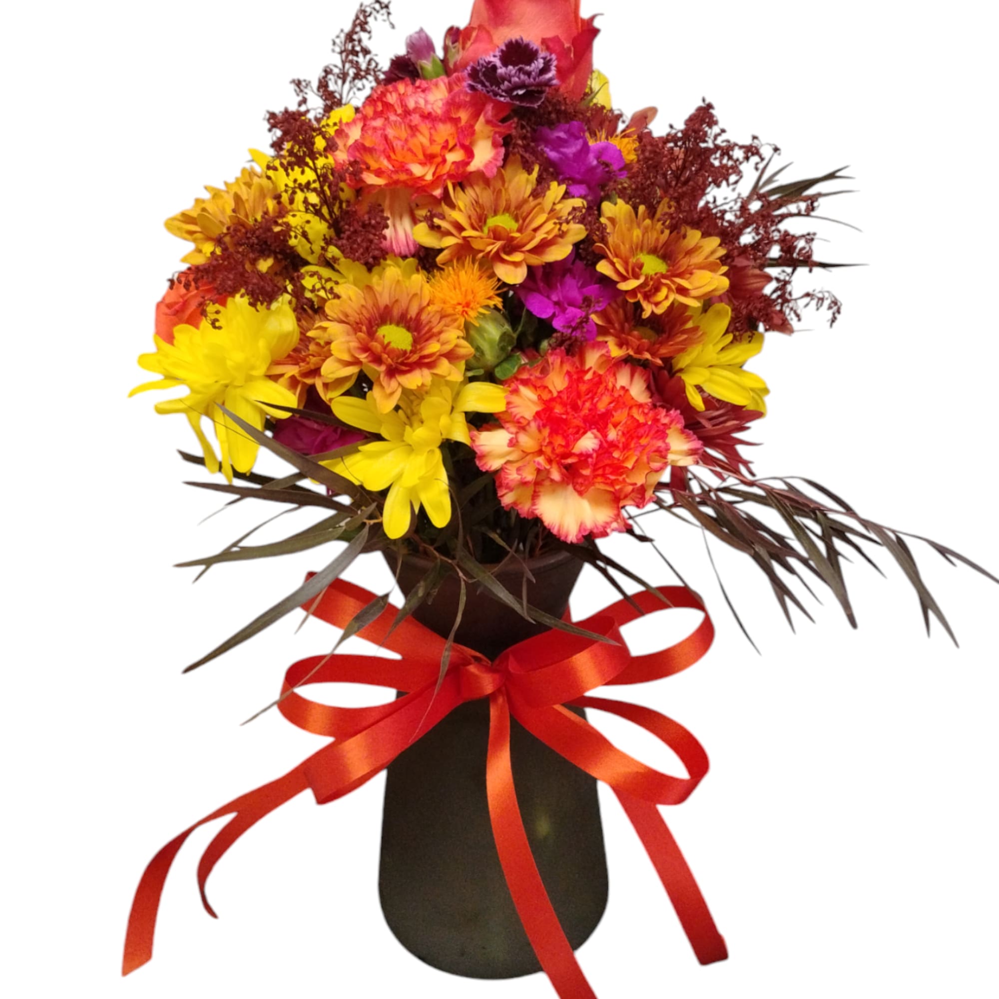 Colorful bouquet of mixed flowers in a dark vase with a red ribbon