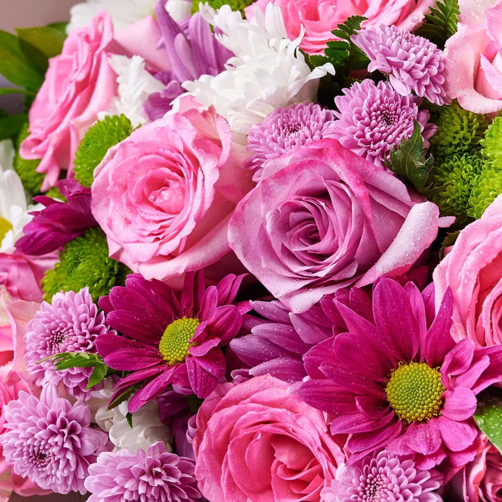 Pink and purple bouquet of roses and daisies