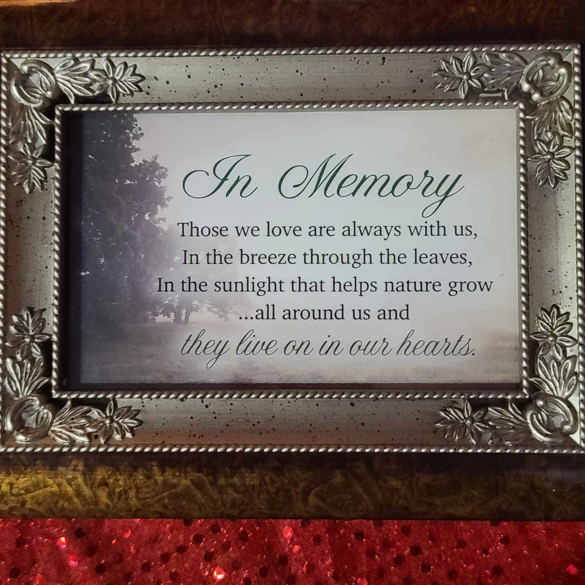 Framed memorial plaque with an "In Memory" message