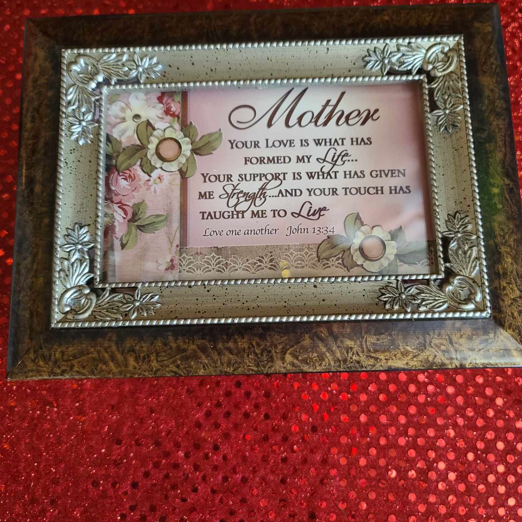 Decorative framed Mother plaque with floral accents on a red textured background
