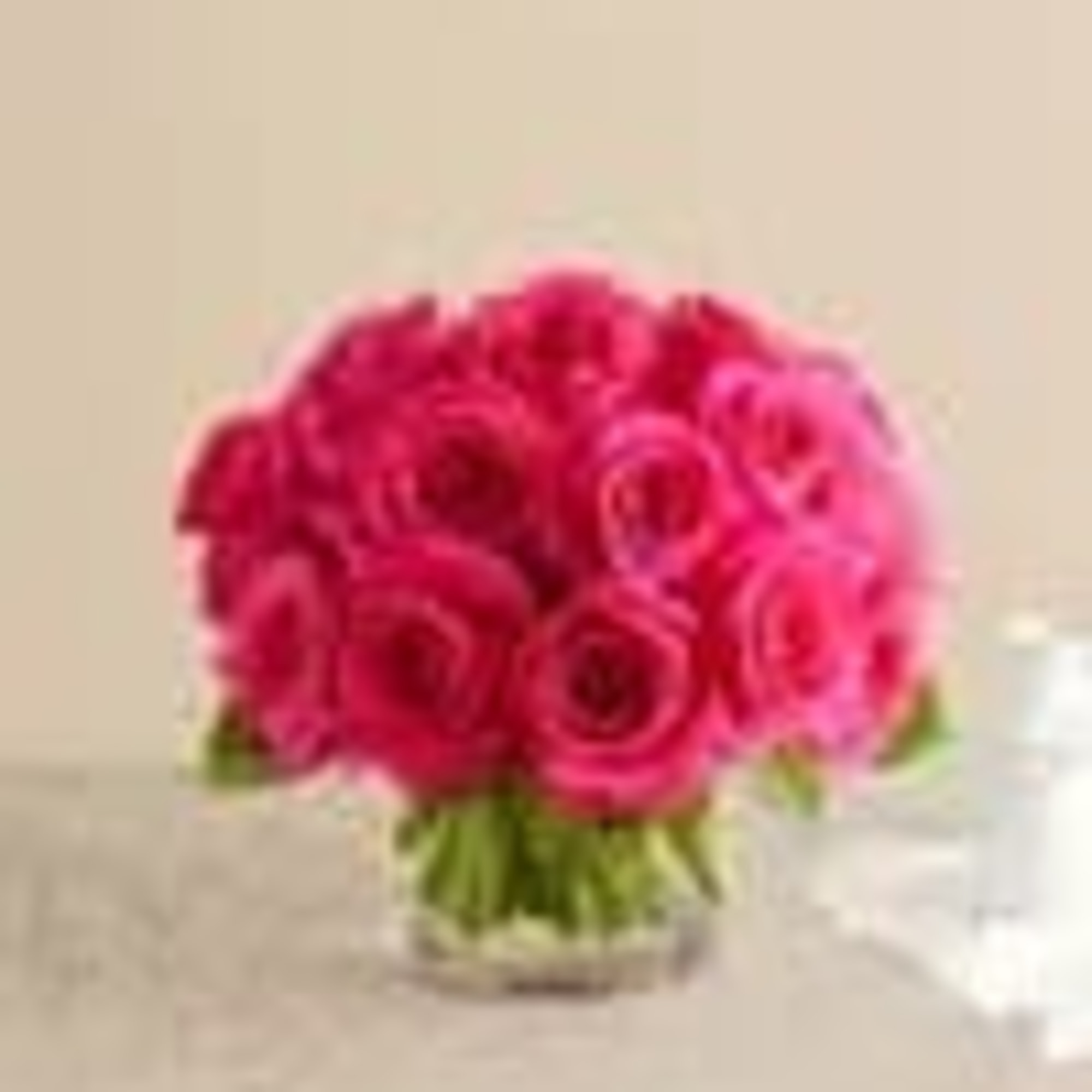 Pink rose bouquet in a clear glass vase