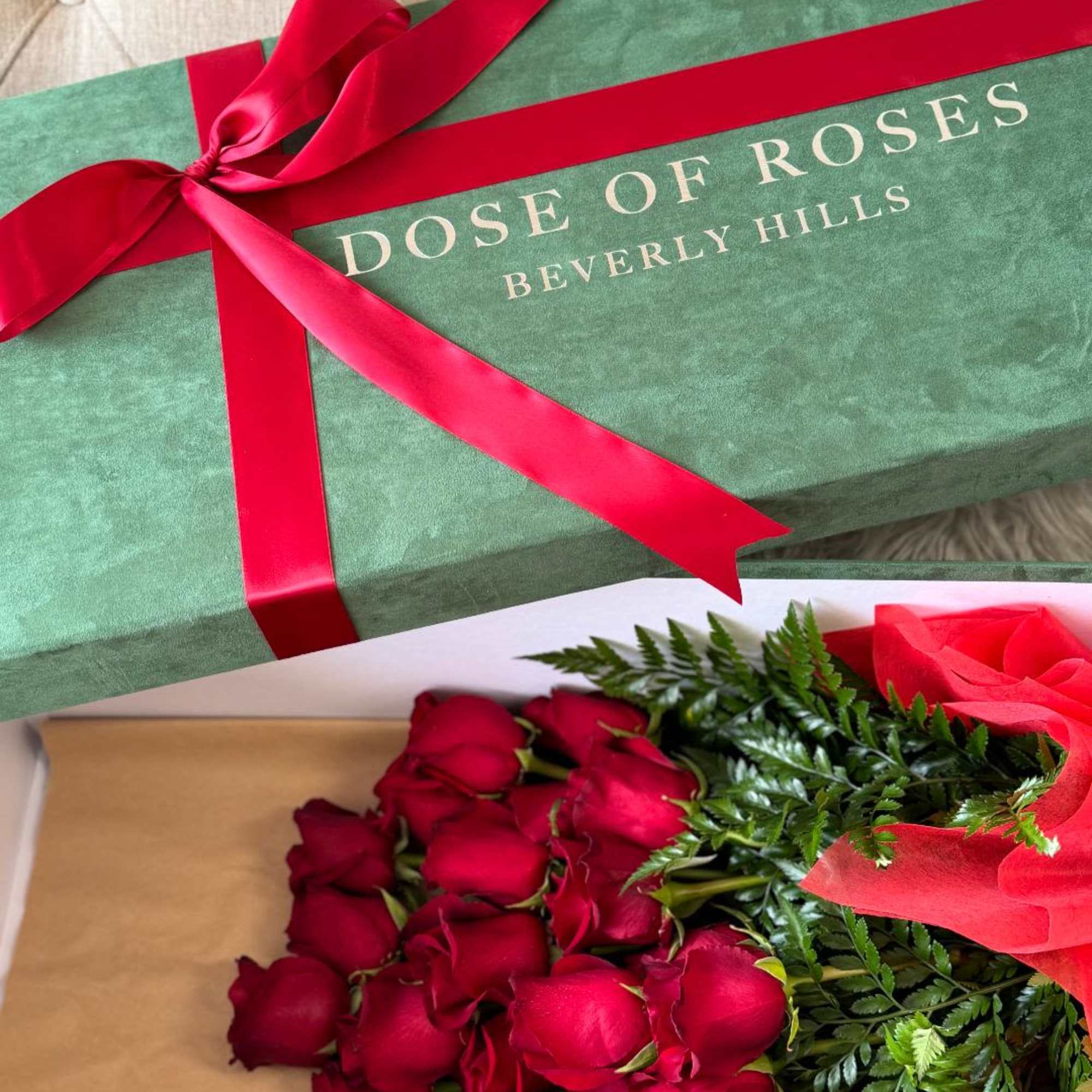 Box of red roses tied with a red ribbon