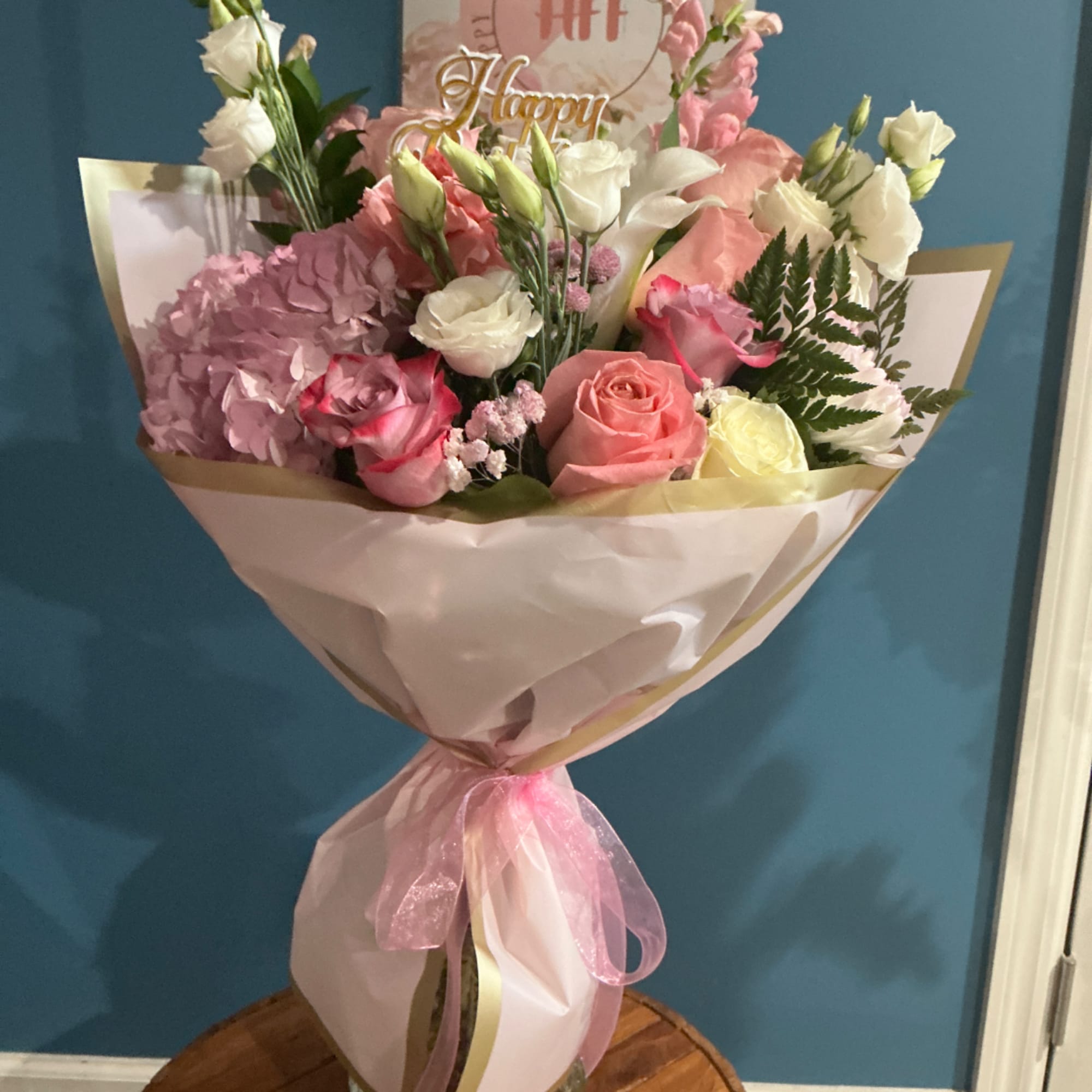 Pink and white mixed bouquet wrapped in paper with a pink ribbon, photo 2 of 4