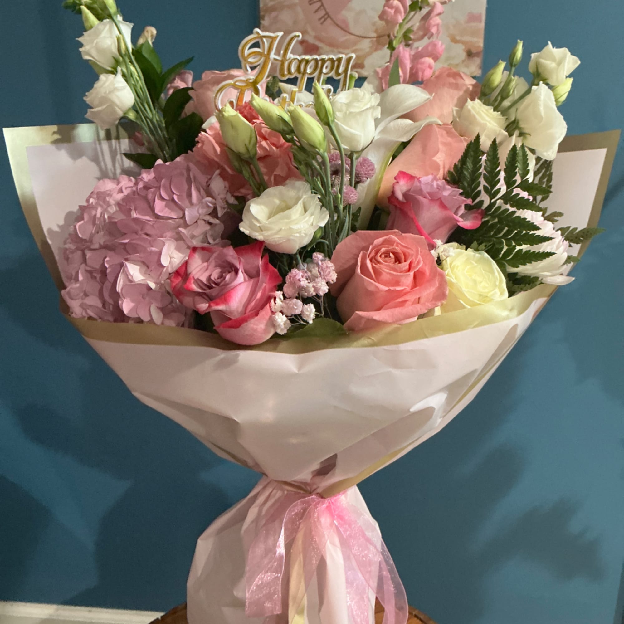 Pink and white mixed bouquet wrapped in paper with a pink ribbon, photo 4 of 4