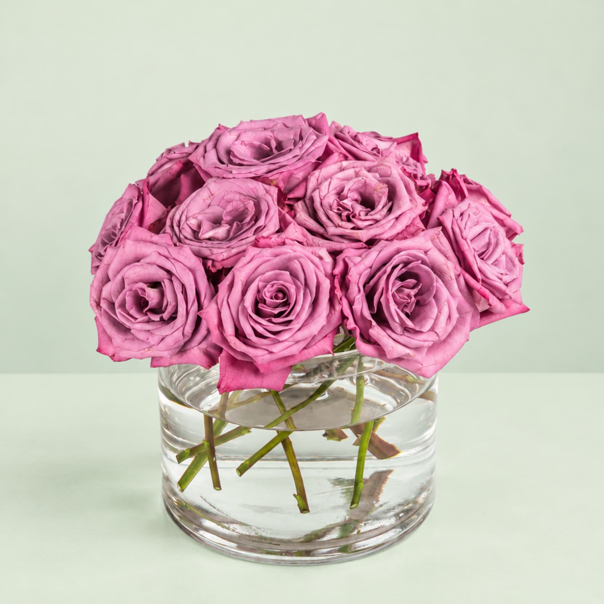 Pink roses arranged in a clear glass vase
