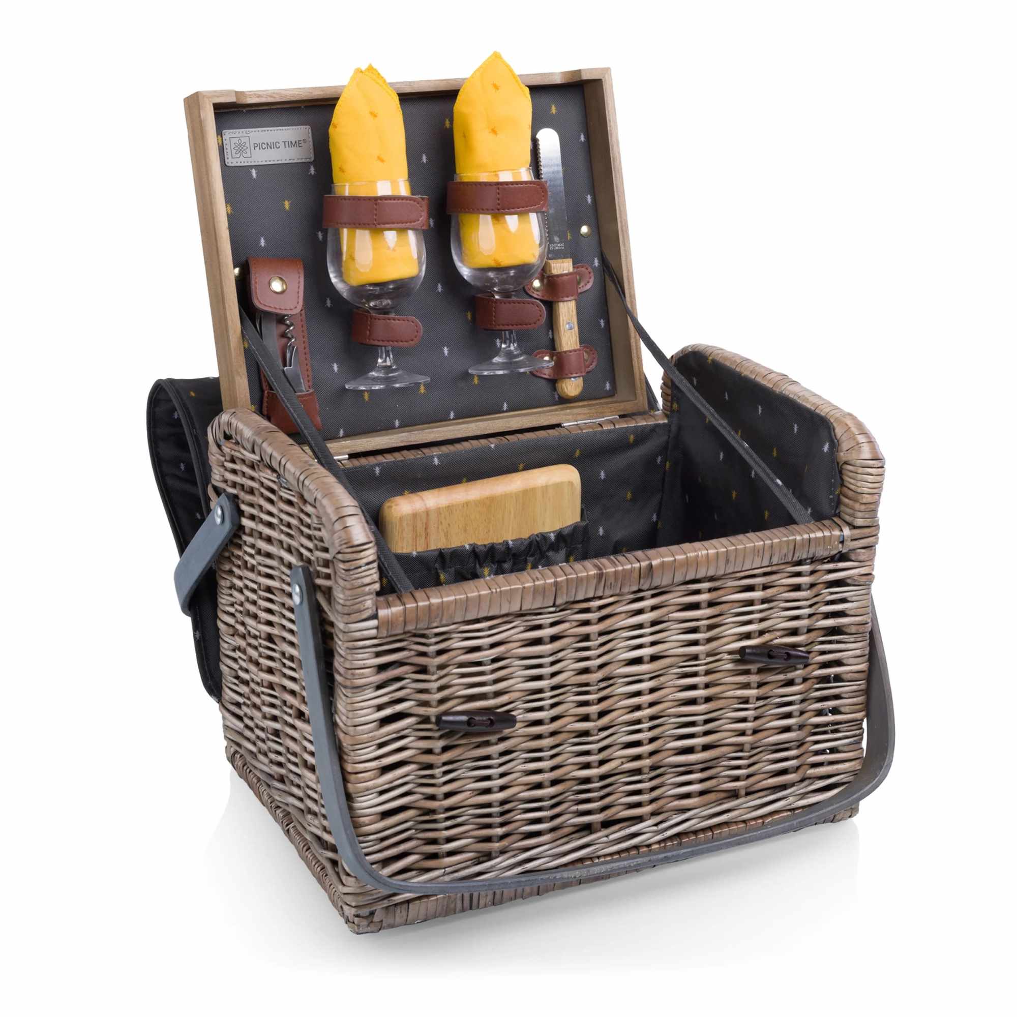 Wicker picnic basket with wine glasses, napkins, and utensils