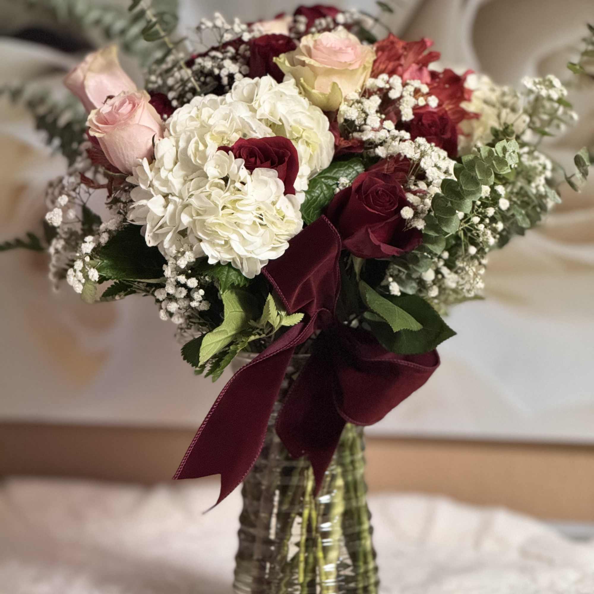 Combination of roses, hydrangeas, alstroemerias and more, creating a luxurious arrangement to