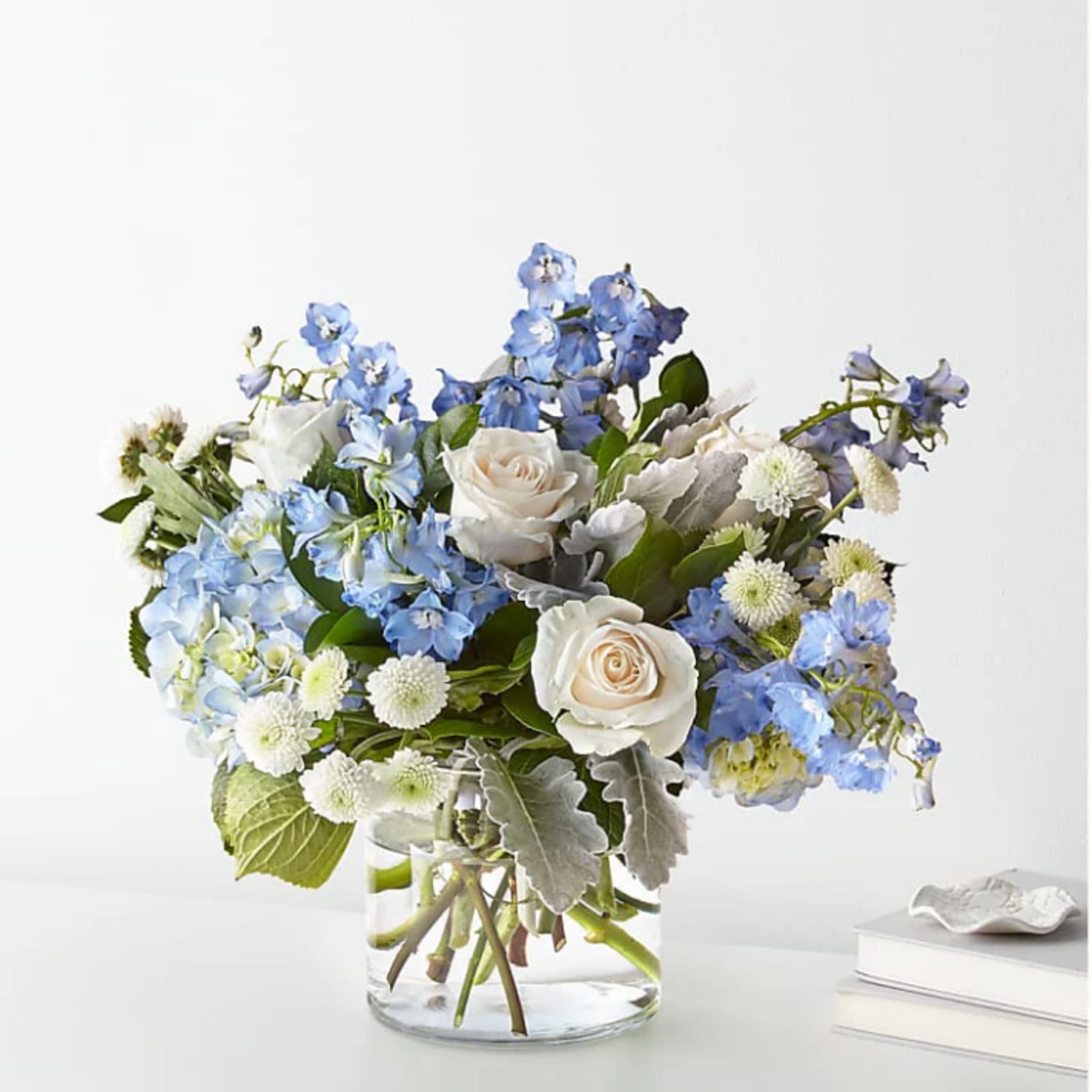 FTD design, let this uplifting arrangement be reminders of the clear skies