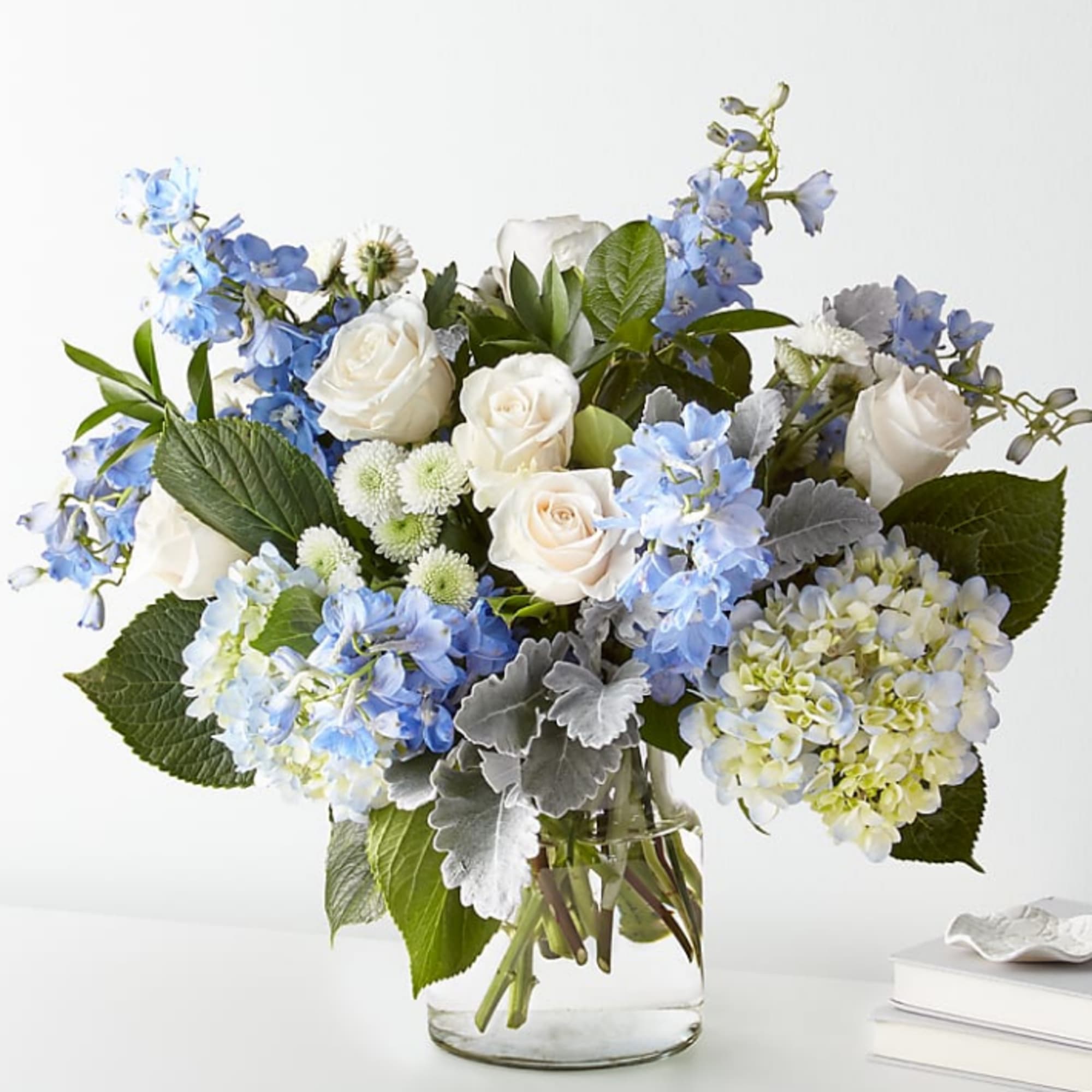 FTD design, let this uplifting arrangement be reminders of the clear skies