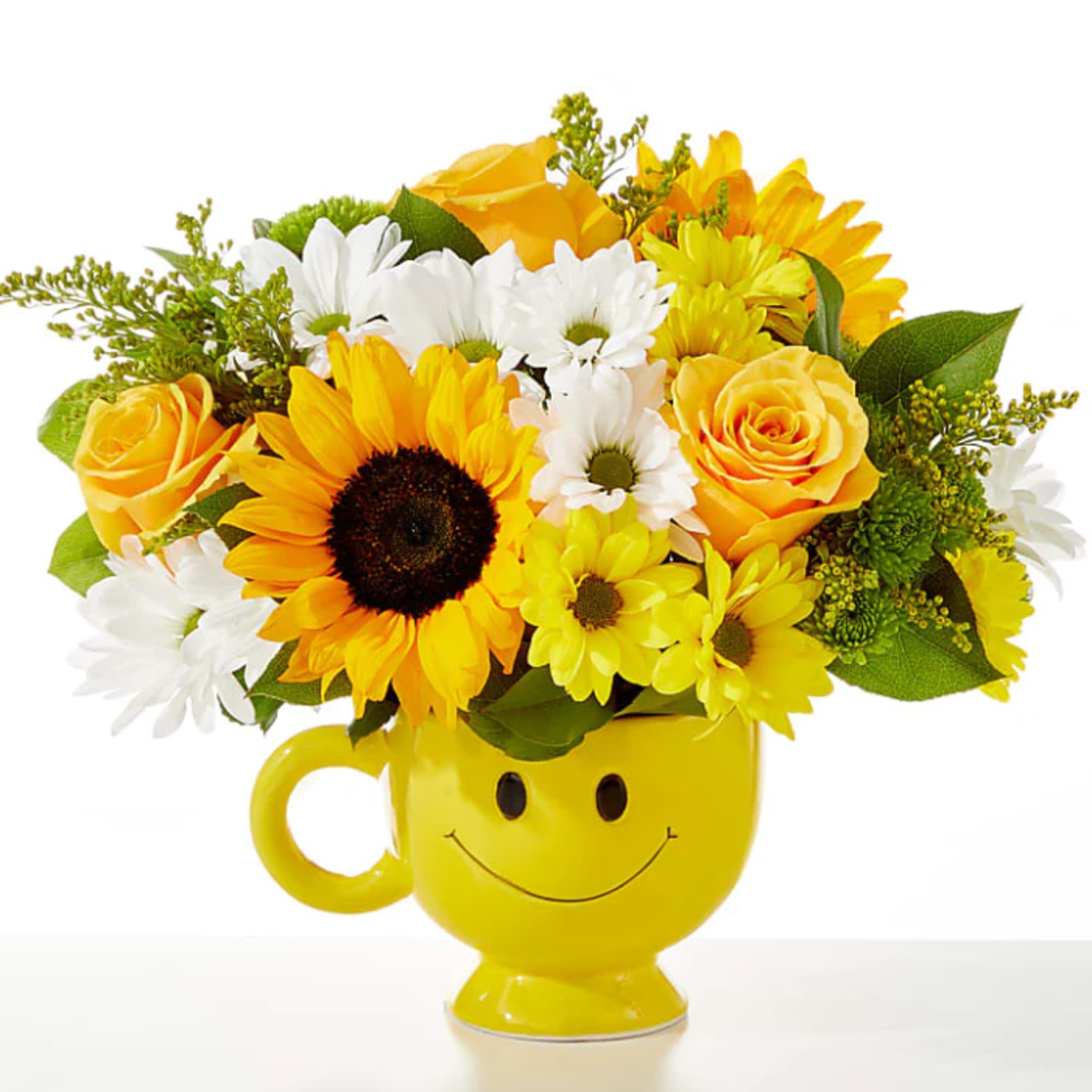 Yellow and white flower arrangement in a smiley-face mug