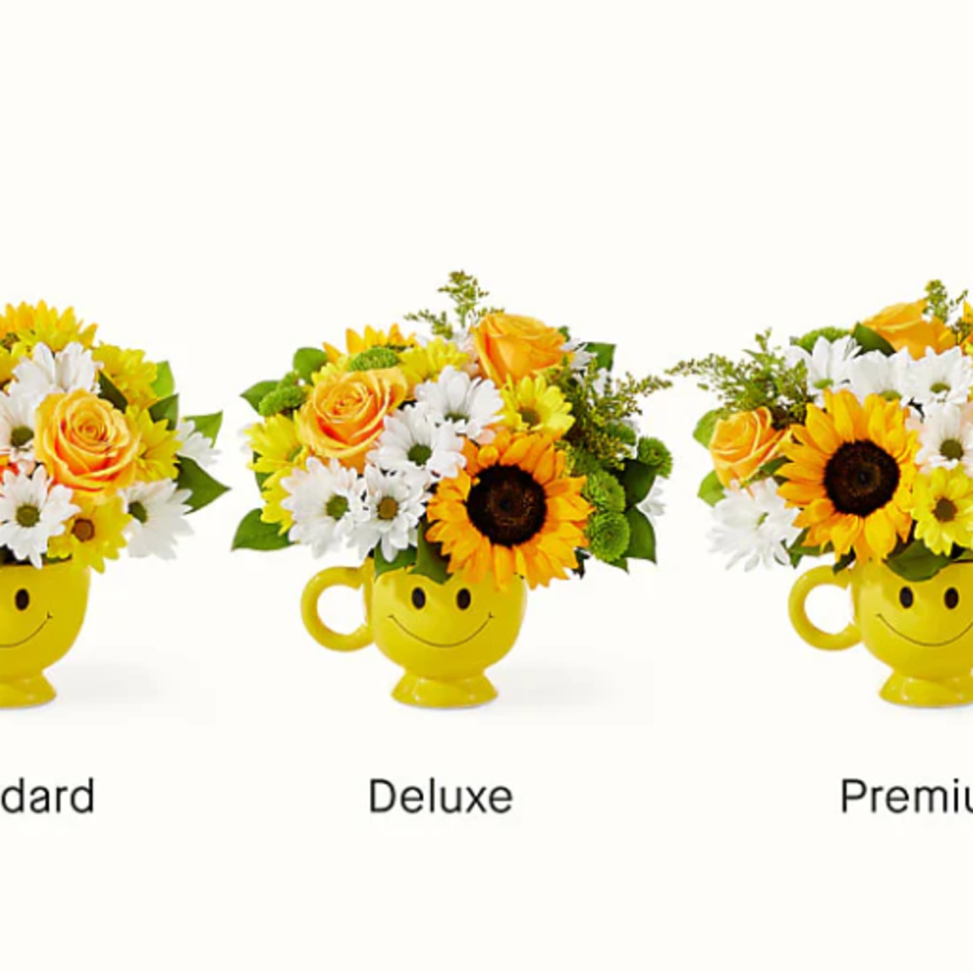 Yellow smiley-face mugs filled with sunflowers and daisies