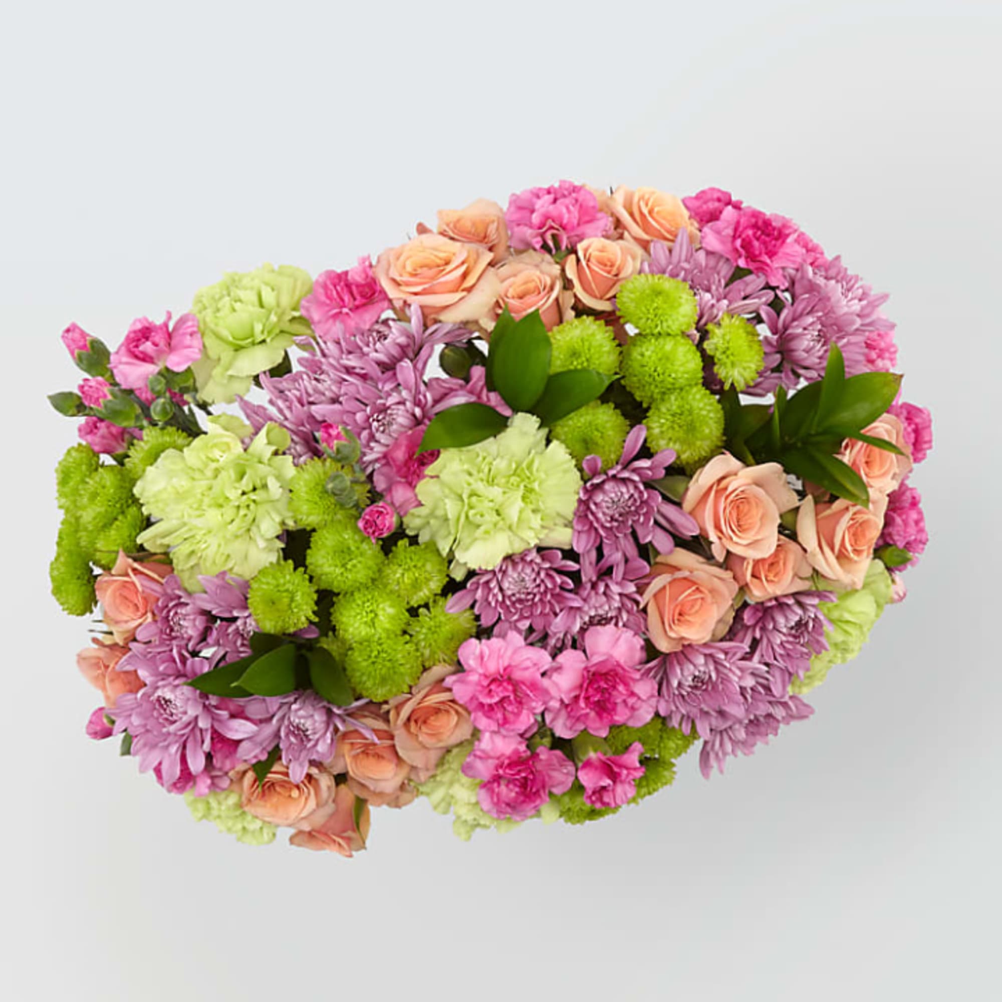 Mixed bouquet of pink, peach, and green flowers