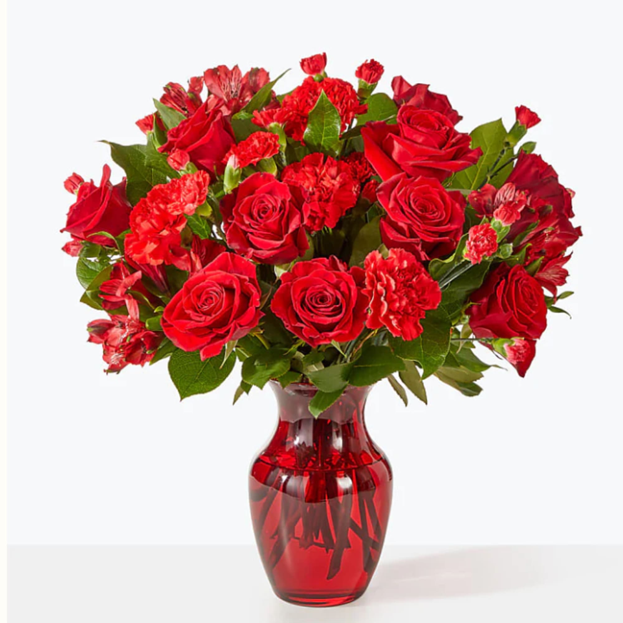 A valentine in bloom, this all red arrangement of roses, carnations and