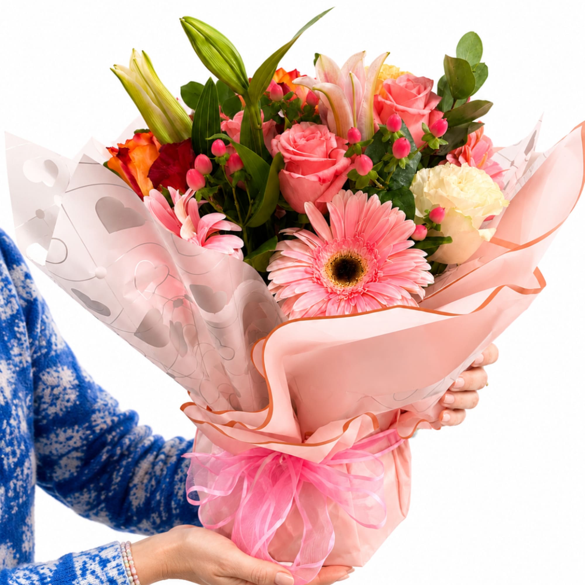 Pink mixed bouquet with roses, lilies, and a gerbera daisy in pink wrap