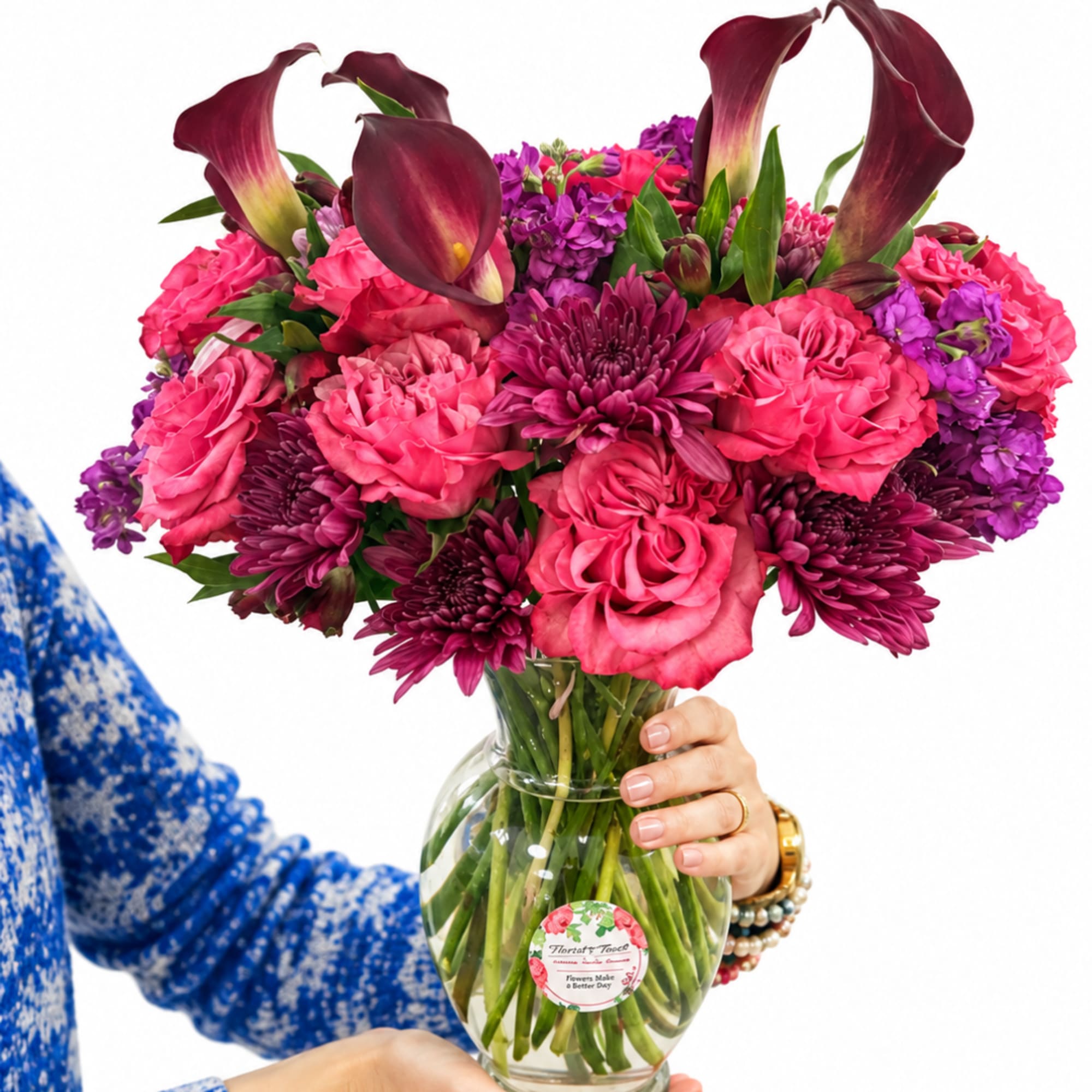 Pink and purple flower bouquet in a clear glass vase