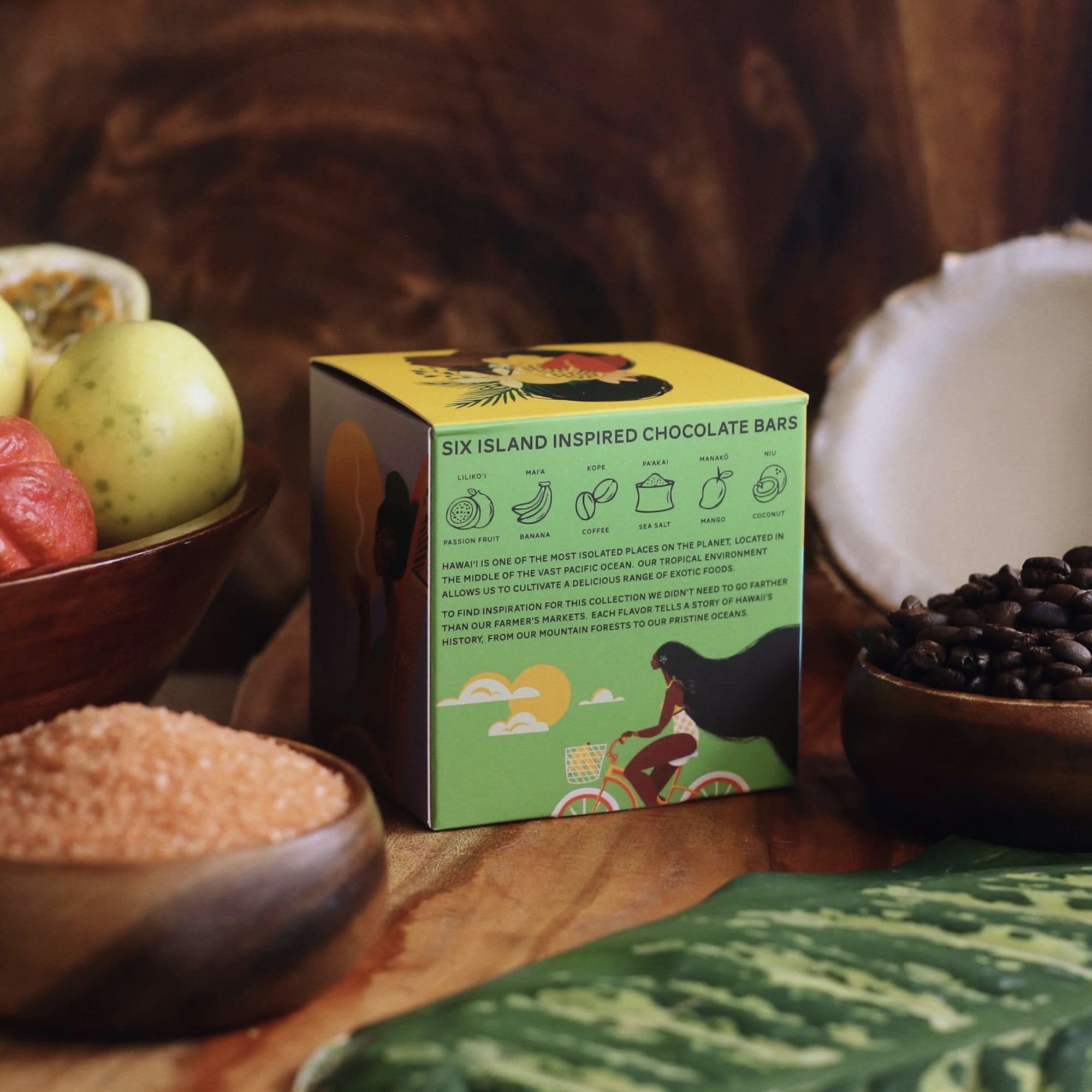Box of chocolate bars surrounded by fruit and bowls of ingredients