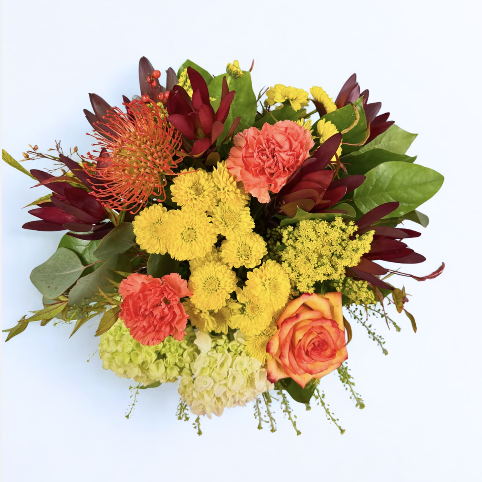 Mixed bouquet with yellow chrysanthemums, coral carnations, and orange roses