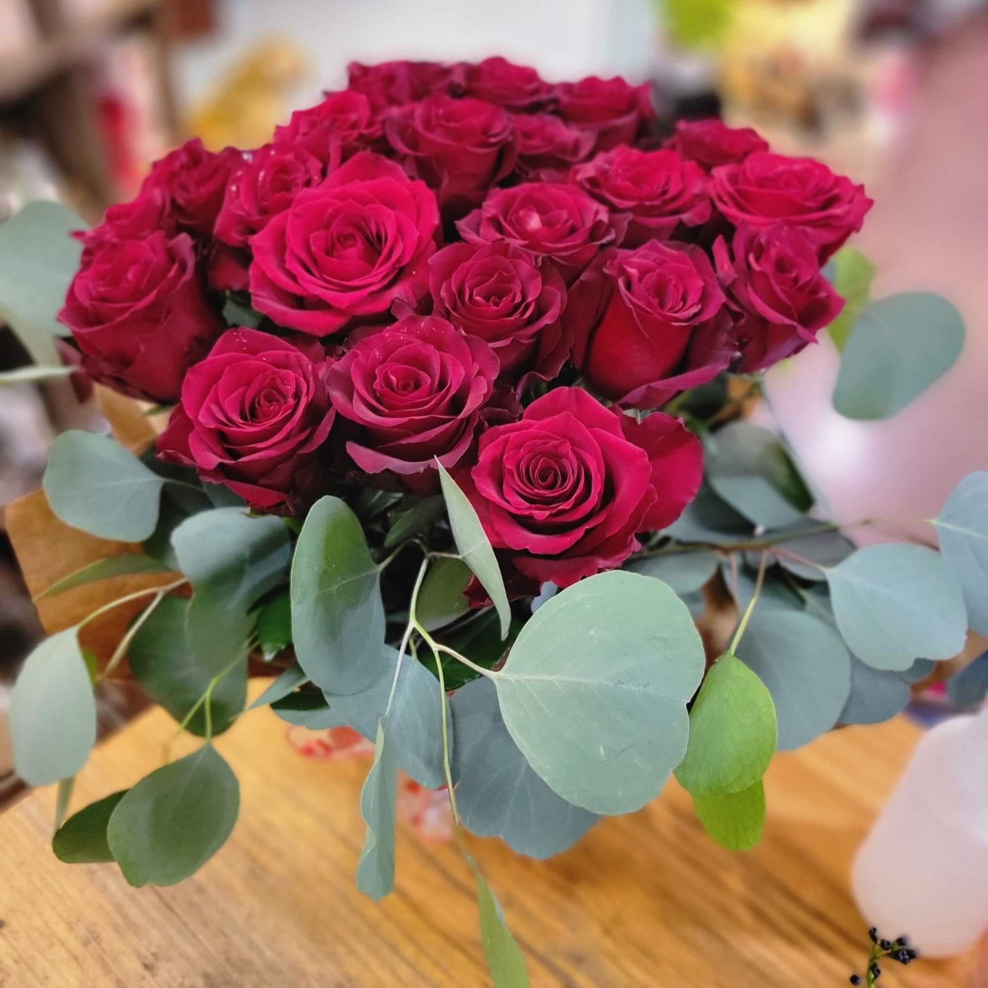 Bouquet of deep pink roses with eucalyptus leaves