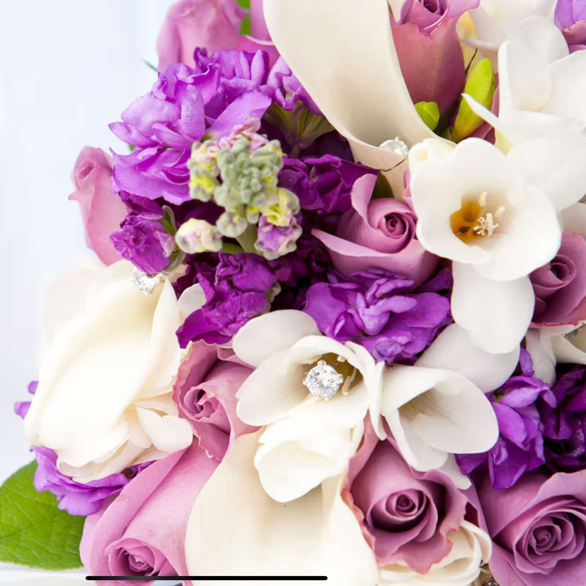 An all white tribute, this white cross funeral spray is pure and