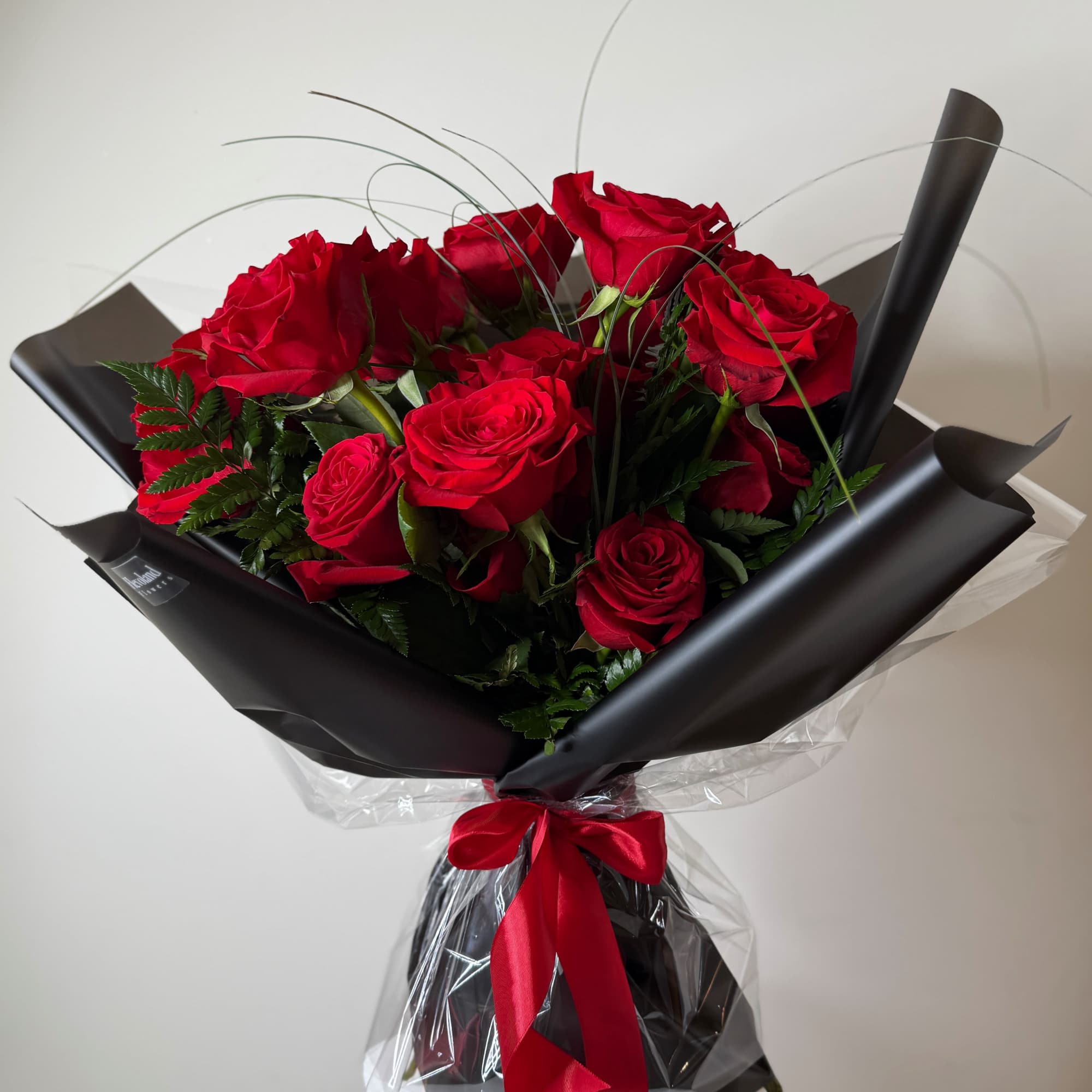 Premium Ecuadorian red roses, designed with a clean and refined finish.

Accented with