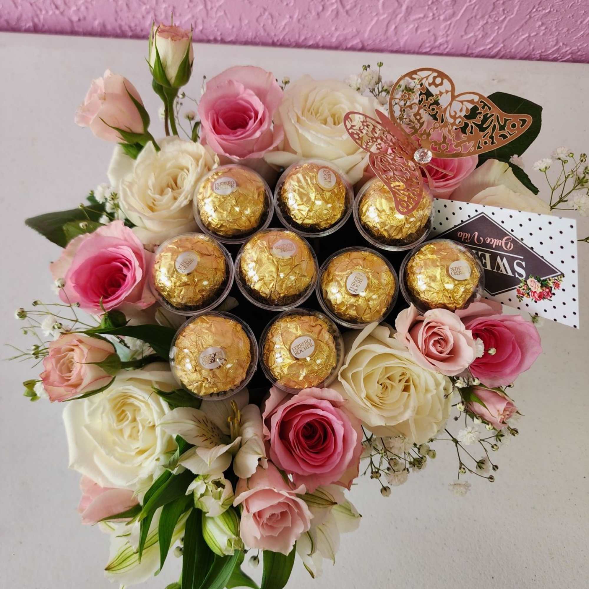 Beautiful arrangemet in a heart box.pic the  Colors . Red, Pink