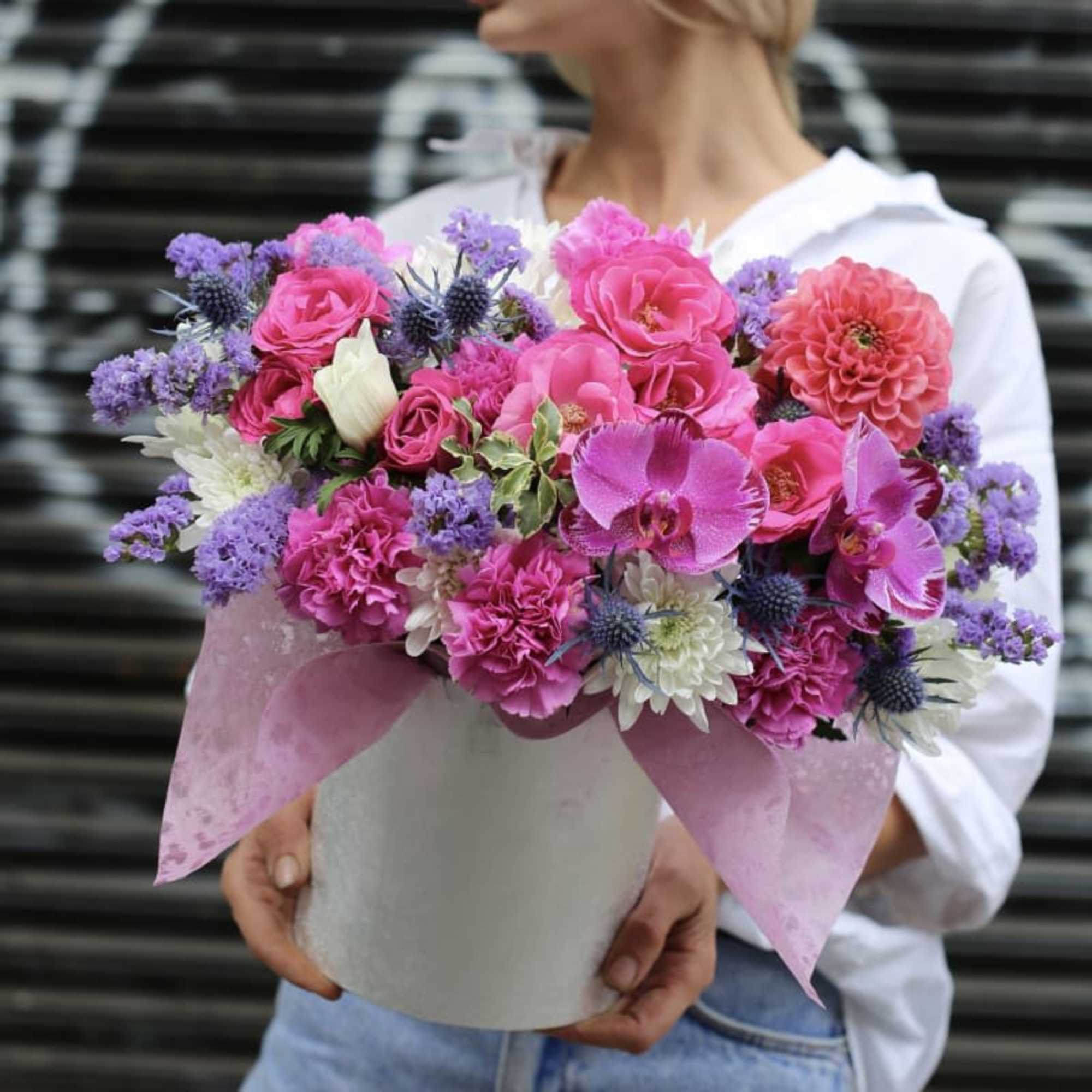 Pink and purple mixed bouquet in a white hatbox