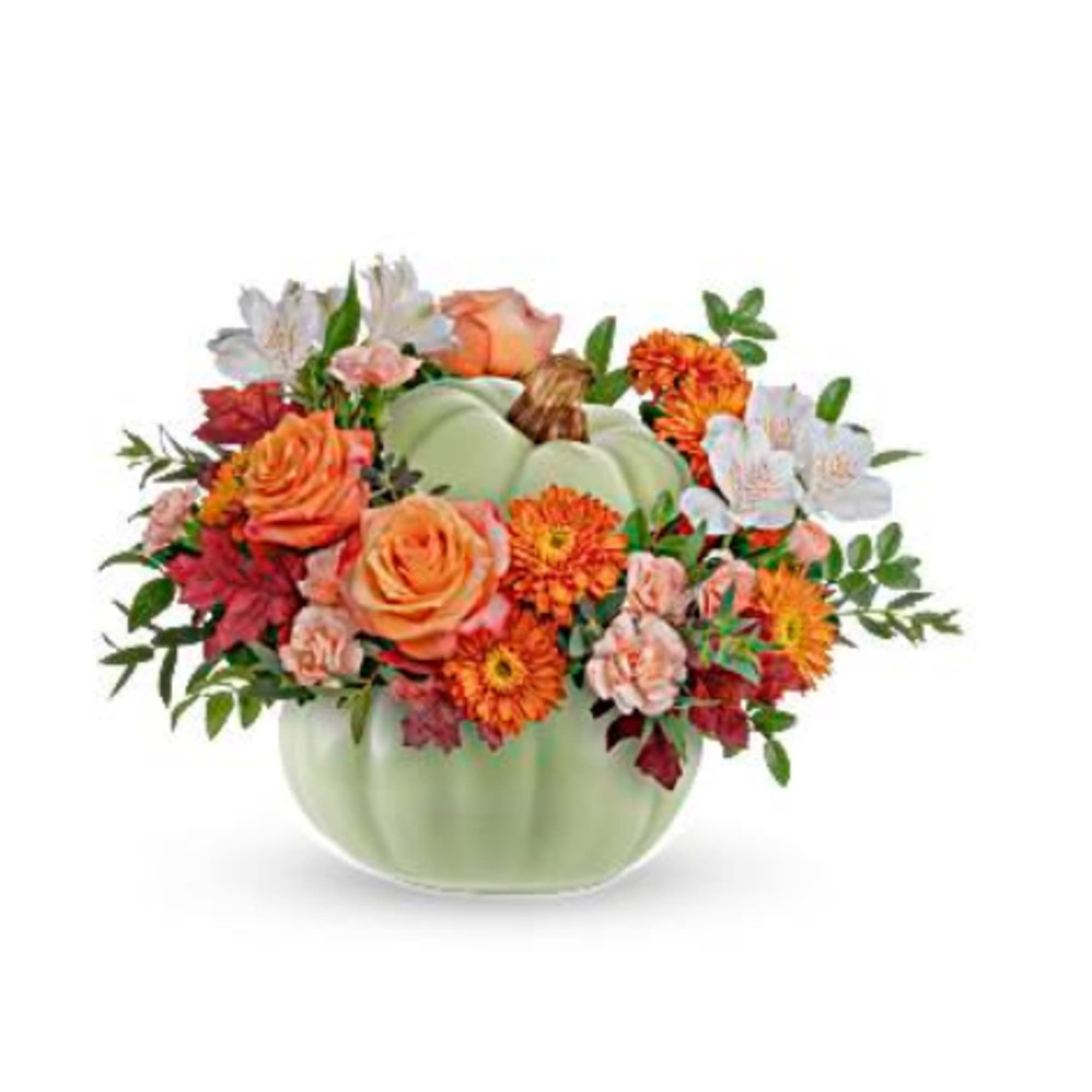 Orange and white flowers arranged in a pale green pumpkin vase
