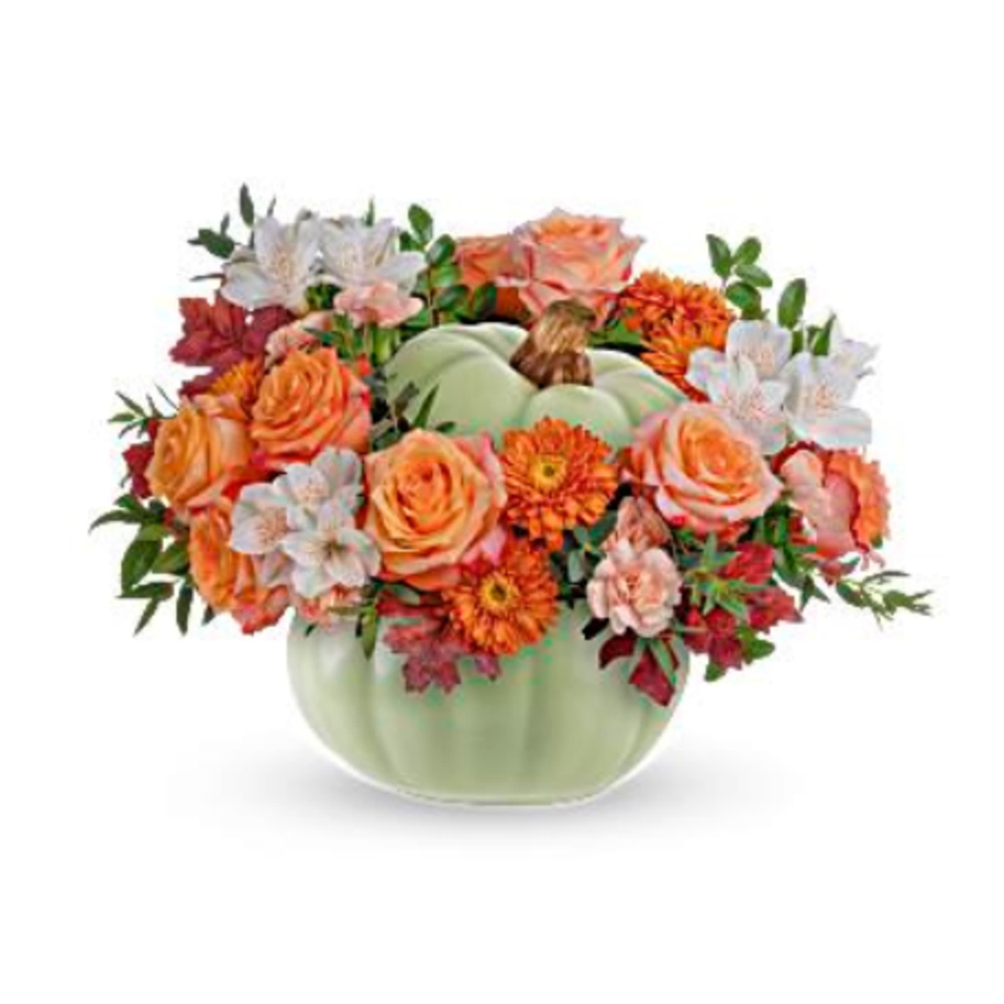 Orange and white flowers arranged in a pale green pumpkin vase